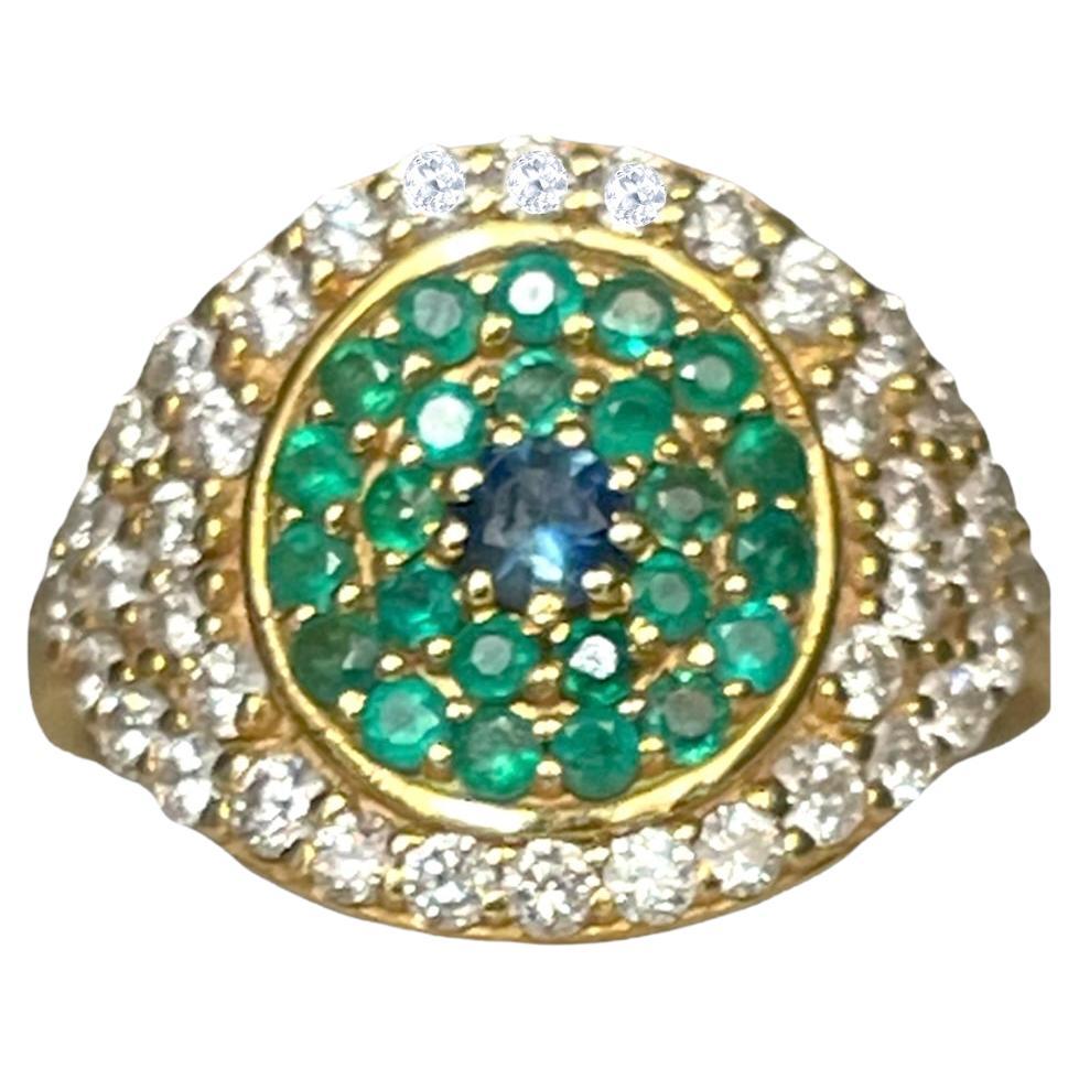 Large Eye Ring with Diamonds and Emeralds in Gold in stock