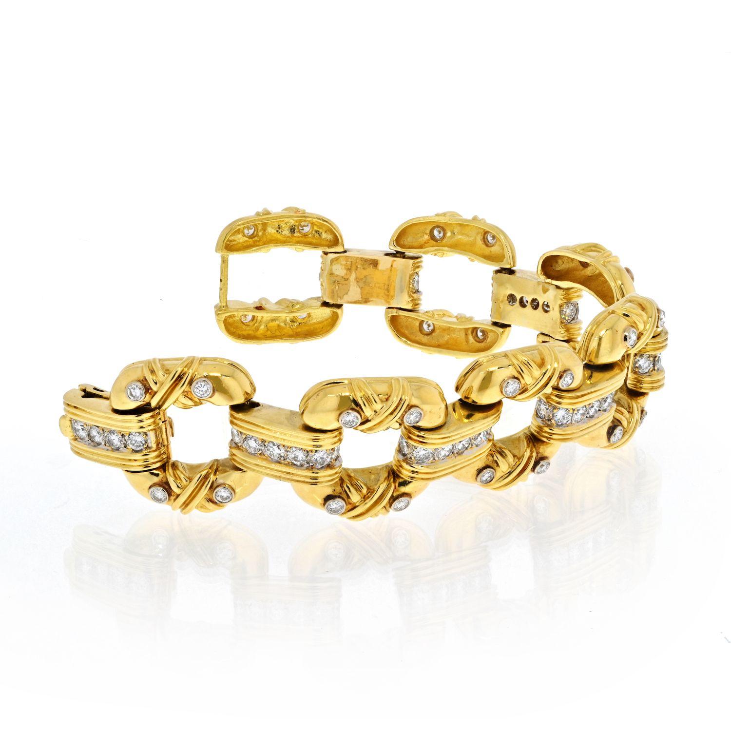 Large estate 18k yellow gold link bracelet that features soft cushion like open links with bezel and prong set diamonds. 
8 inches long. 
1 inch wide. 
Grams 113gr.