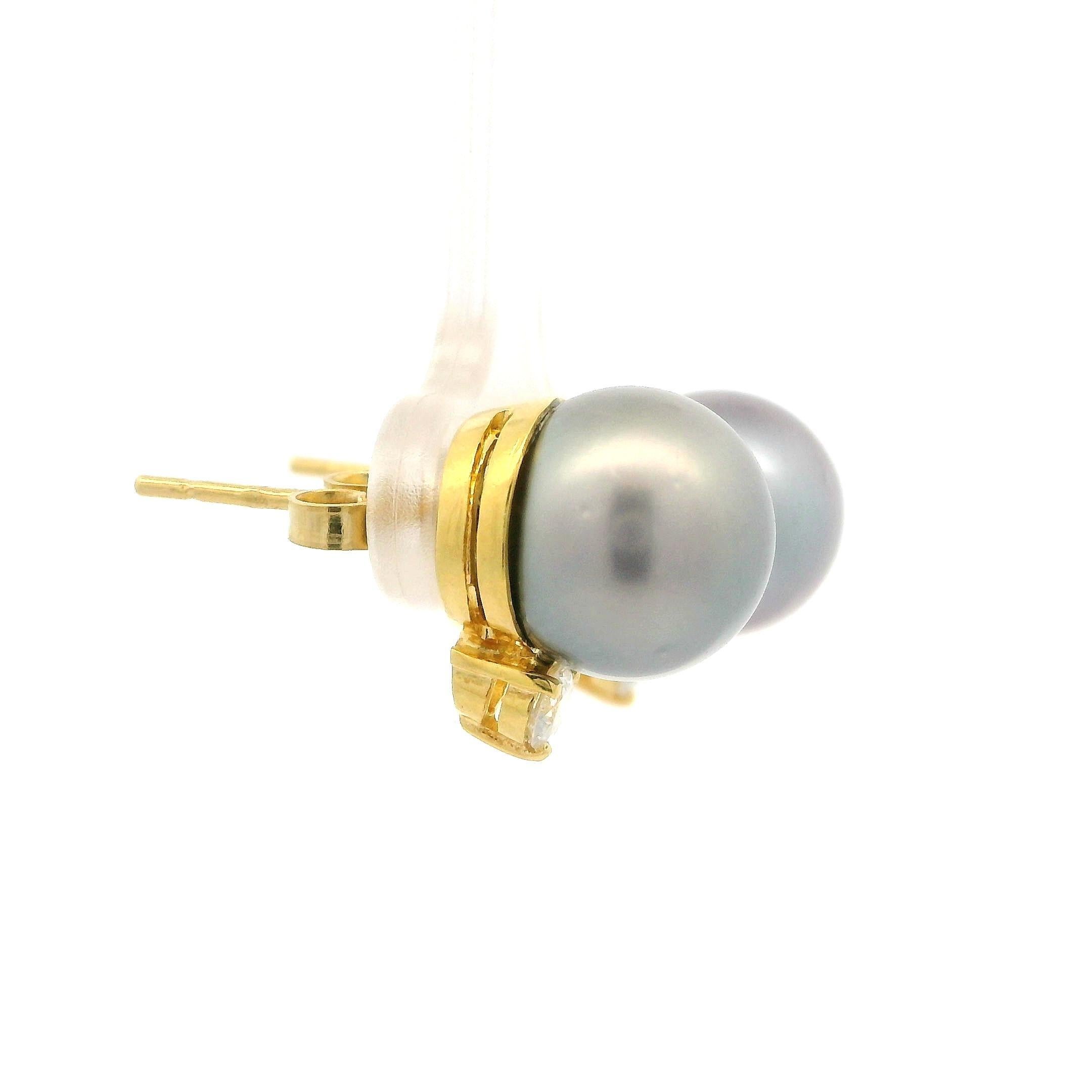 –Stone(s)–
(2) Cultured Tahitian Pearls - Round Shape - Gray Color - Excellent Luster - 10.6-10.7mm (approx.)
(2) Natural Genuine Diamonds - Round Brilliant Cut - Prong Set - F Color - VS1 Clarity - 0.30ctw (approx.)

Material: Solid 18k Yellow Gold