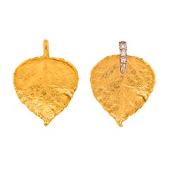 Boucles d'oreilles en or jaune 18K en forme de feuille