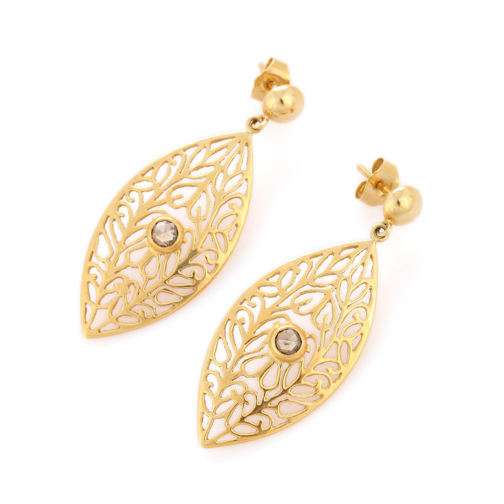 Filigree Leaf Diamond Dangle Earrings in 18K Gold to make a statement with your look. You shall need dangle earrings to make a statement with your look. These earrings create a sparkling, luxurious look featuring round cut diamond.
April birthstone
