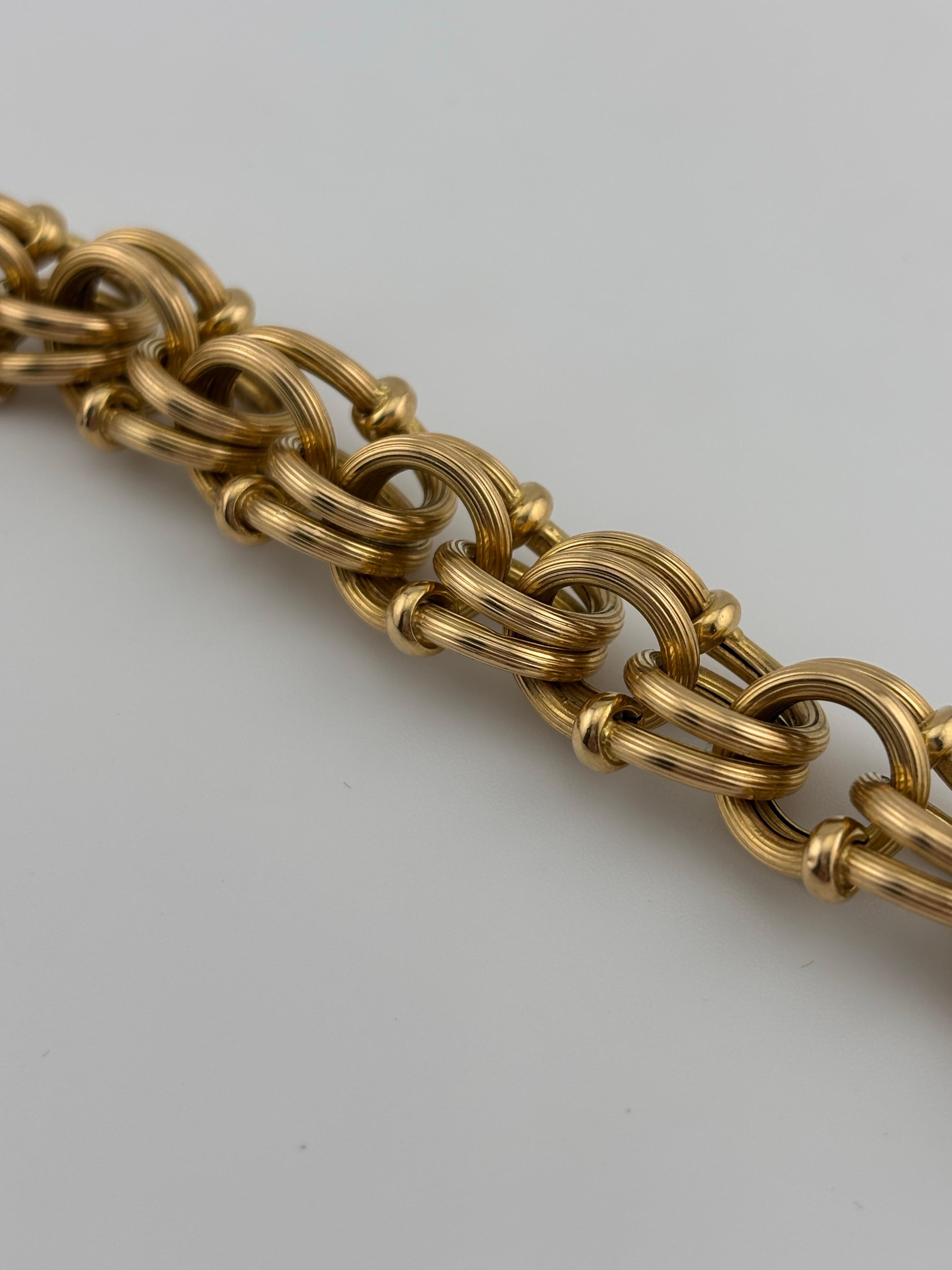 Beautiful link bracelet with intricate design. Please note that the bracelet is 18k yellow gold with a 14k yellow gold clasp.

Material: 18k yellow gold with 14k yellow gold clasp
Weight: 26.9 grams
Length: 8.75 inches
Link width: 13.9 mm