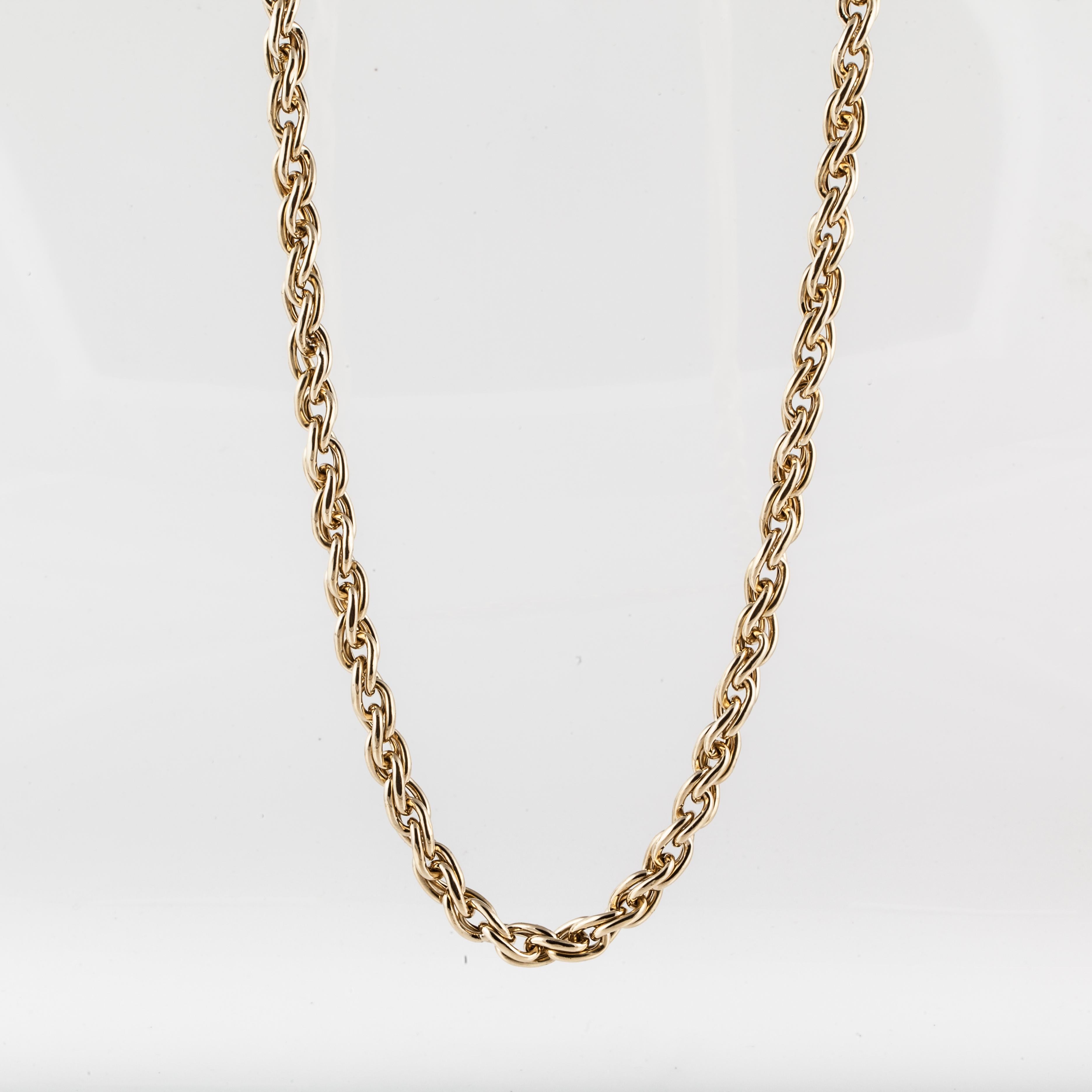 Chain necklace in 18K yellow gold with highly polished double link chain measuring 32 inches long and 5/16 inches wide. 