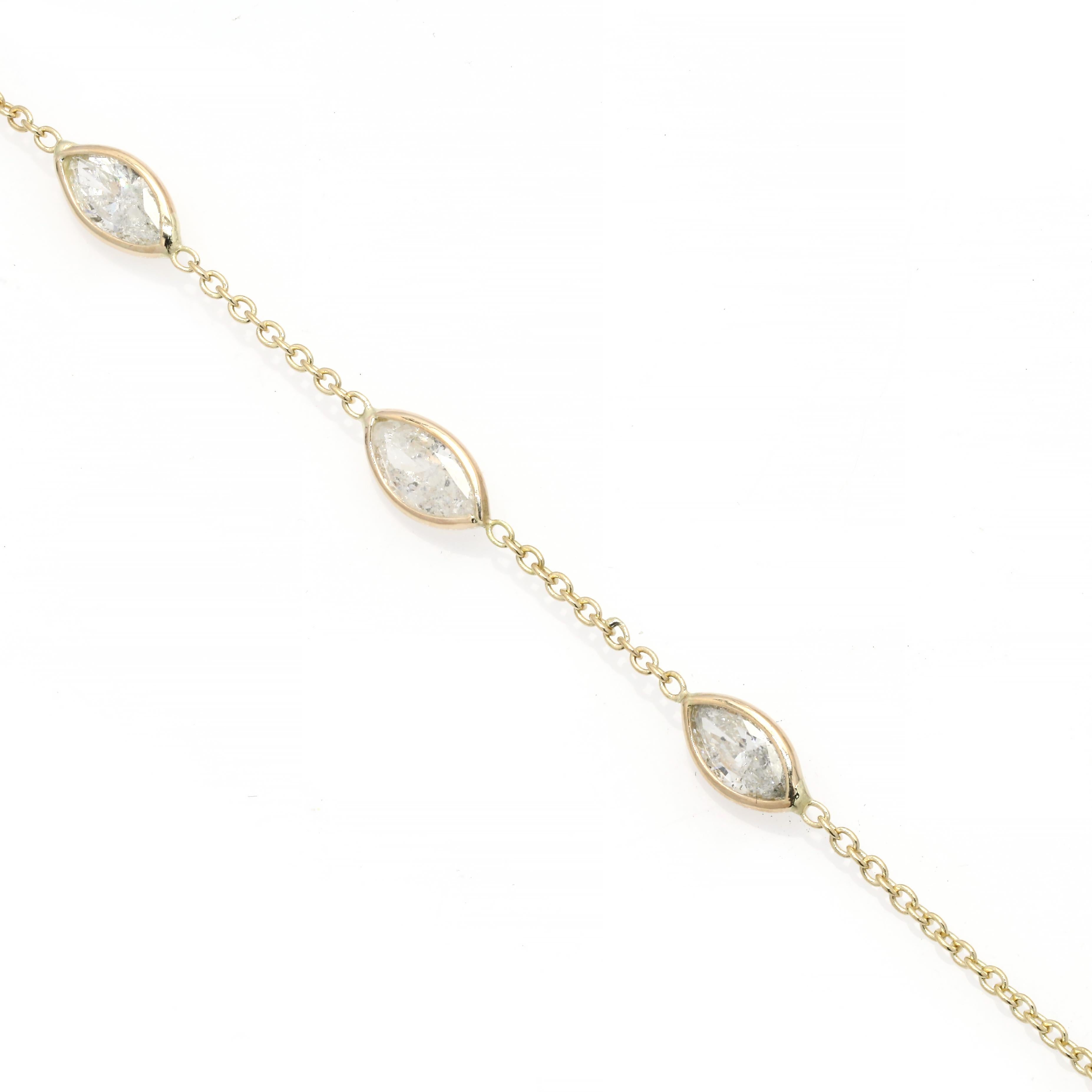 This Stackable Natural Diamond Chain Bracelet in 18K gold showcases sparkling natural diamonds, weighing 0.50 carats. 
April birthstone diamond brings love, fame, success and prosperity.
Designed with three marquise cut diamonds set in bezel setting