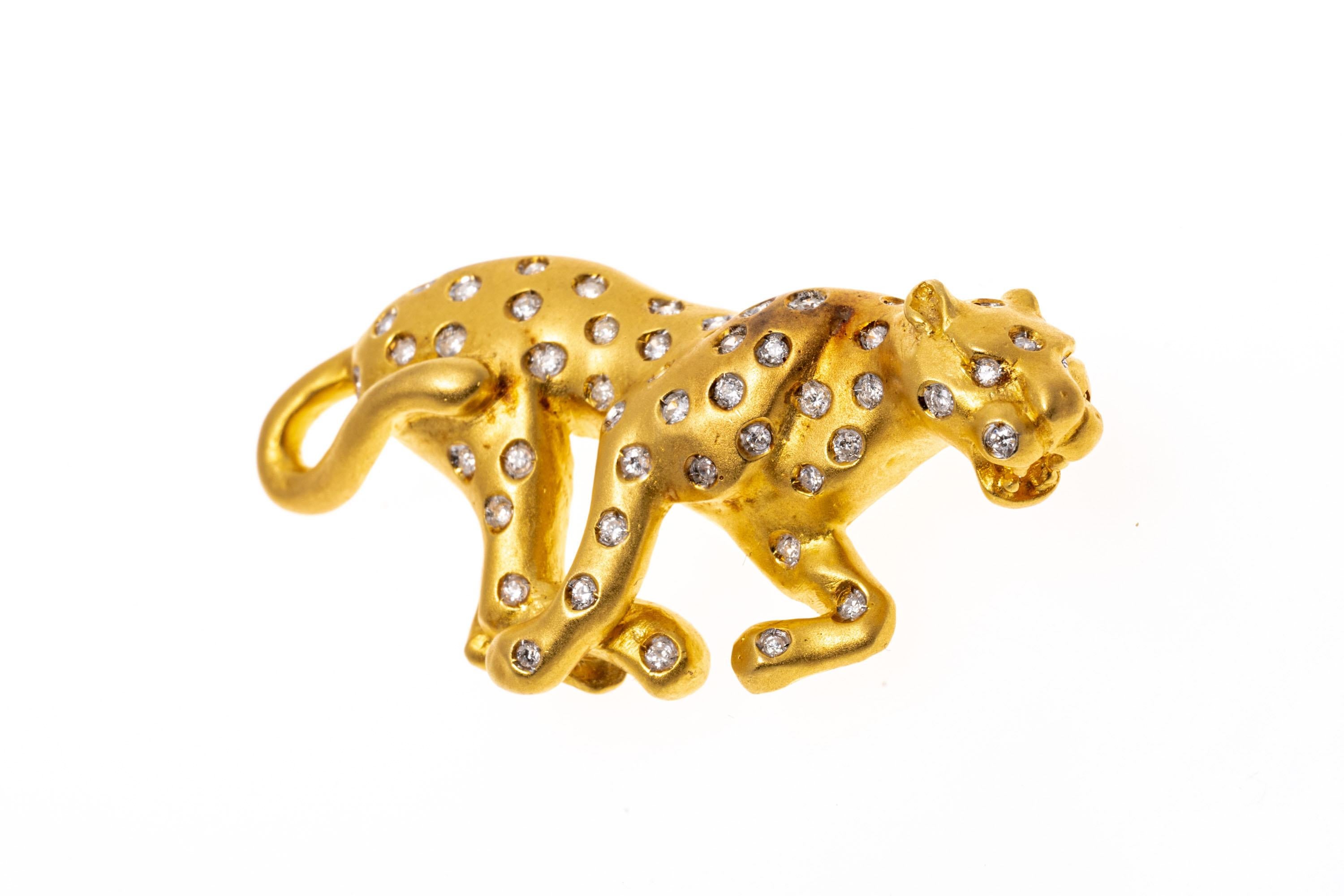 18k yellow gold brooch. This delightful brooch is a stalking leopard profile, matte finished and decorated throughout with round faceted diamonds, approximately 0.49 TCW, flush set.
Marks: 18k
Dimensions: 1 13/16