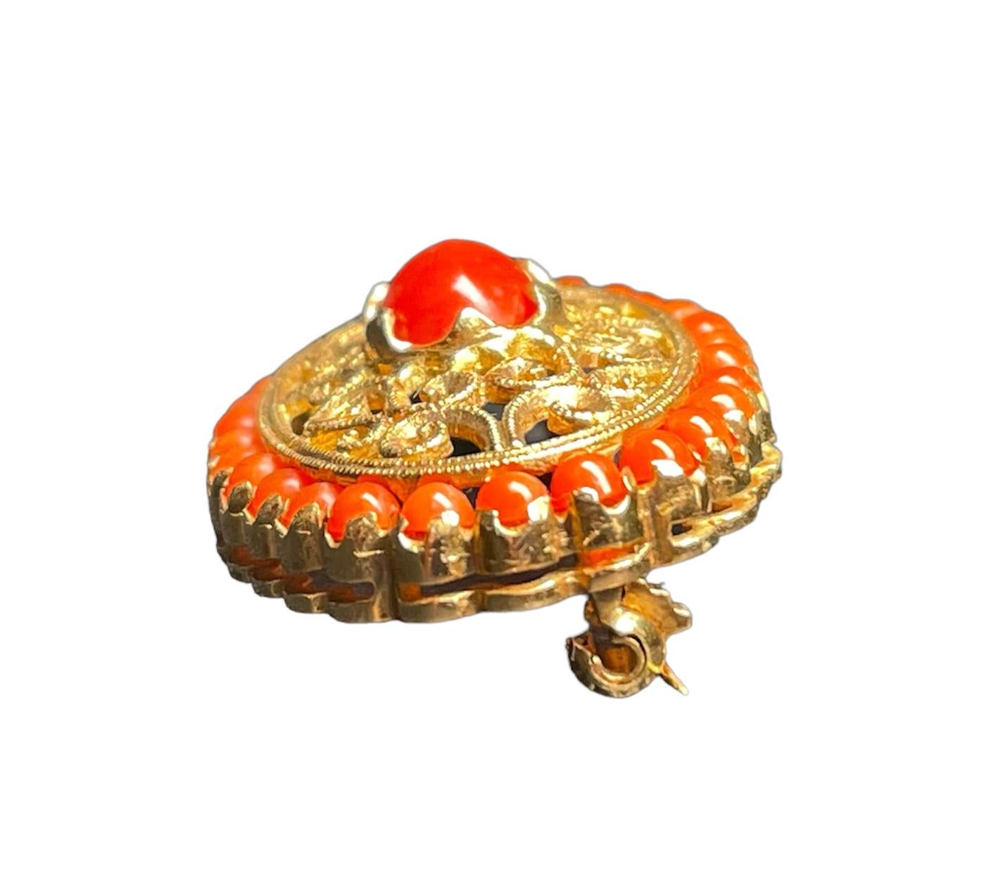 red coral brooch