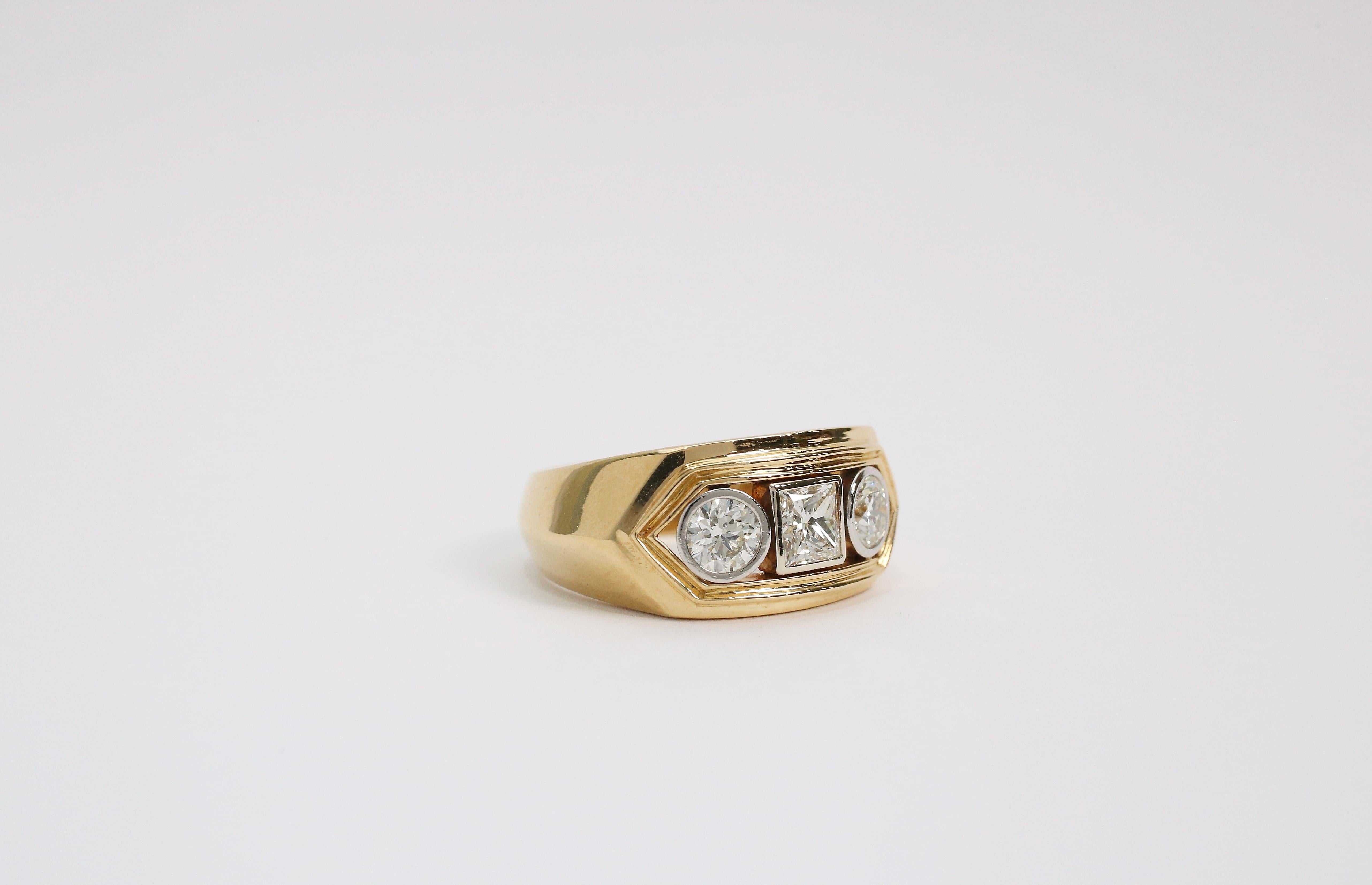 Make a statement with this iconic men’s diamond ring. The tapered knife-edge shank is crafted in high quality 18k yellow gold leading to a unique frame top gallery. Housing two twin round brilliant cut diamonds on either side of a princess cut