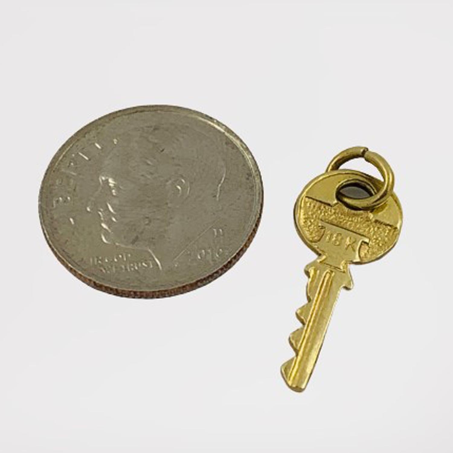 Vintage Key Shaped Charm Pendant Circa 1950's

Crafted of solid 18K yellow gold, this little charm will be the key to your heart. It's a perfect memory marker for first time home buyers, or your time living in a special home. Engraved with the
