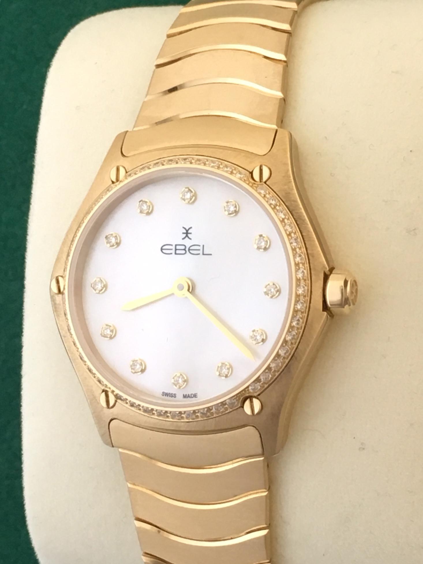 Women's EBEL Sport Classic Midsize 18K yellow gold case with full factory Ebel Diamond bezel, white mother-of-pearl dial with 12 diamonds as hour markers, sapphire crystal with anti reflective treatment underneath, two-tone stainless steel wave link