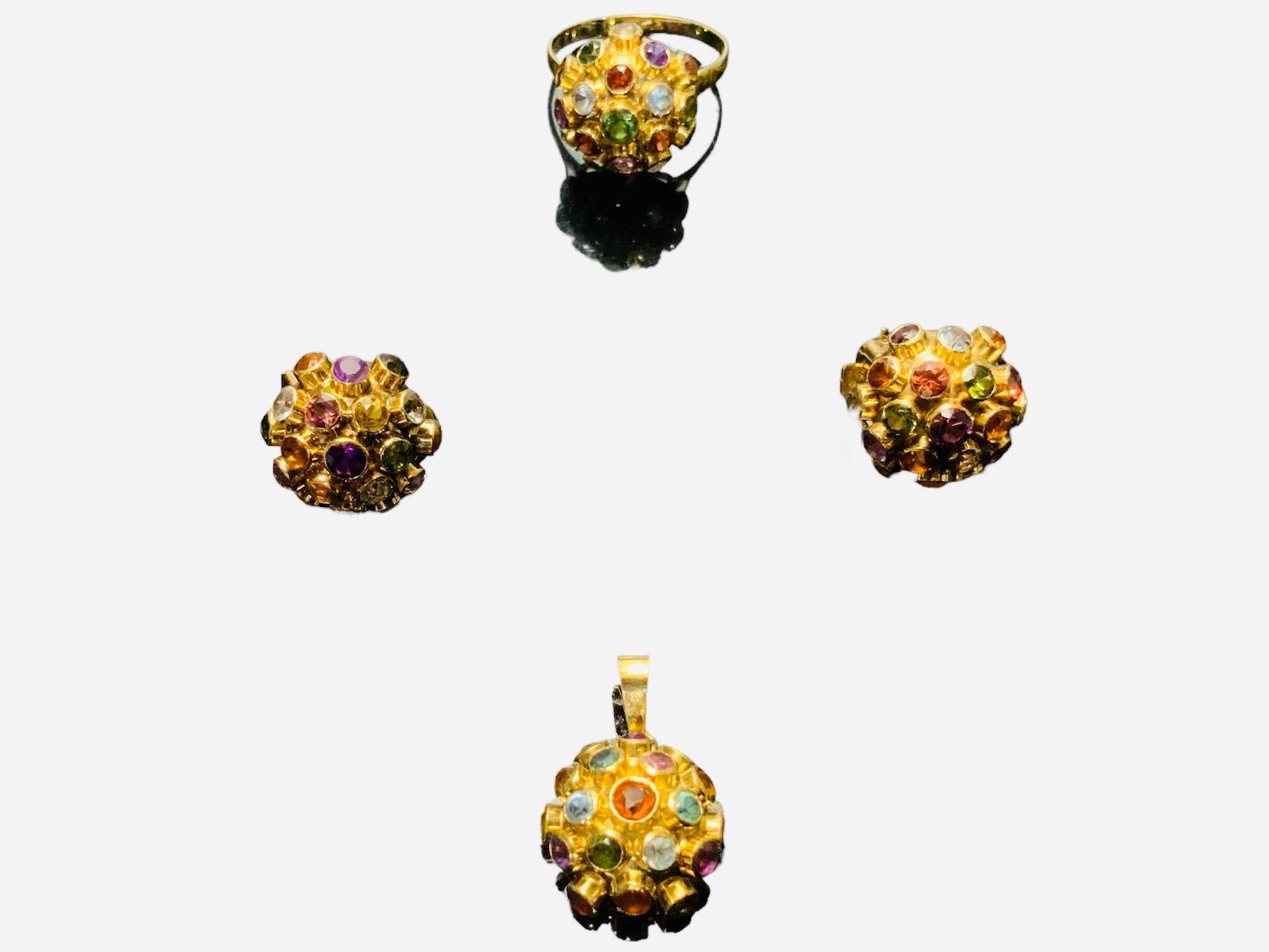 This is an 18K Yellow Gold and multi gems set of pair of earrings, pendant and ring ( mini size Sputnik Set ). The set of multi gems consist of Amethyst, Blue Topaz, Citrine, Garnet and Peridot of 2.5mm and center stone 3.0 mm mounted in bezel