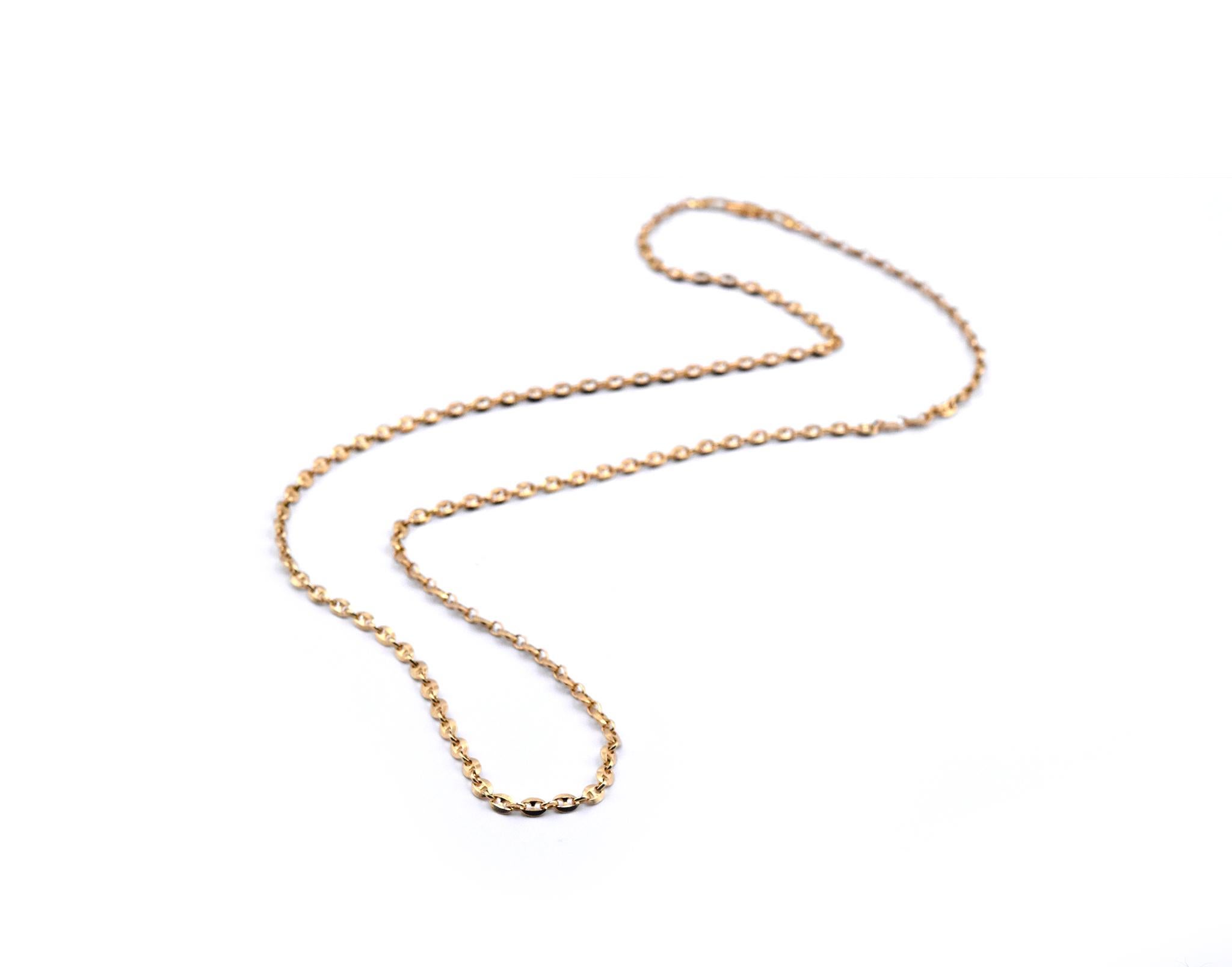 Designer: custom design
Material: 18k yellow gold
Dimensions: necklace measures 23 inches long and 2.95mm wide
Weight: 12.34 grams