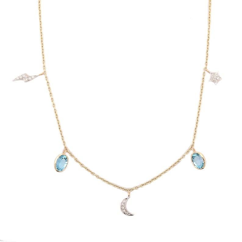 Blue Topaz Necklace in 18K Gold studded with oval cut topaz pieces and diamonds.
Accessorize your look with this elegant blue topaz drop necklace. This stunning piece of jewelry instantly elevates a casual look or dressy outfit. Comfortable and easy