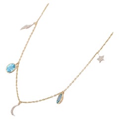 Collier de lune en or jaune 18 carats avec topaze bleue et diamants