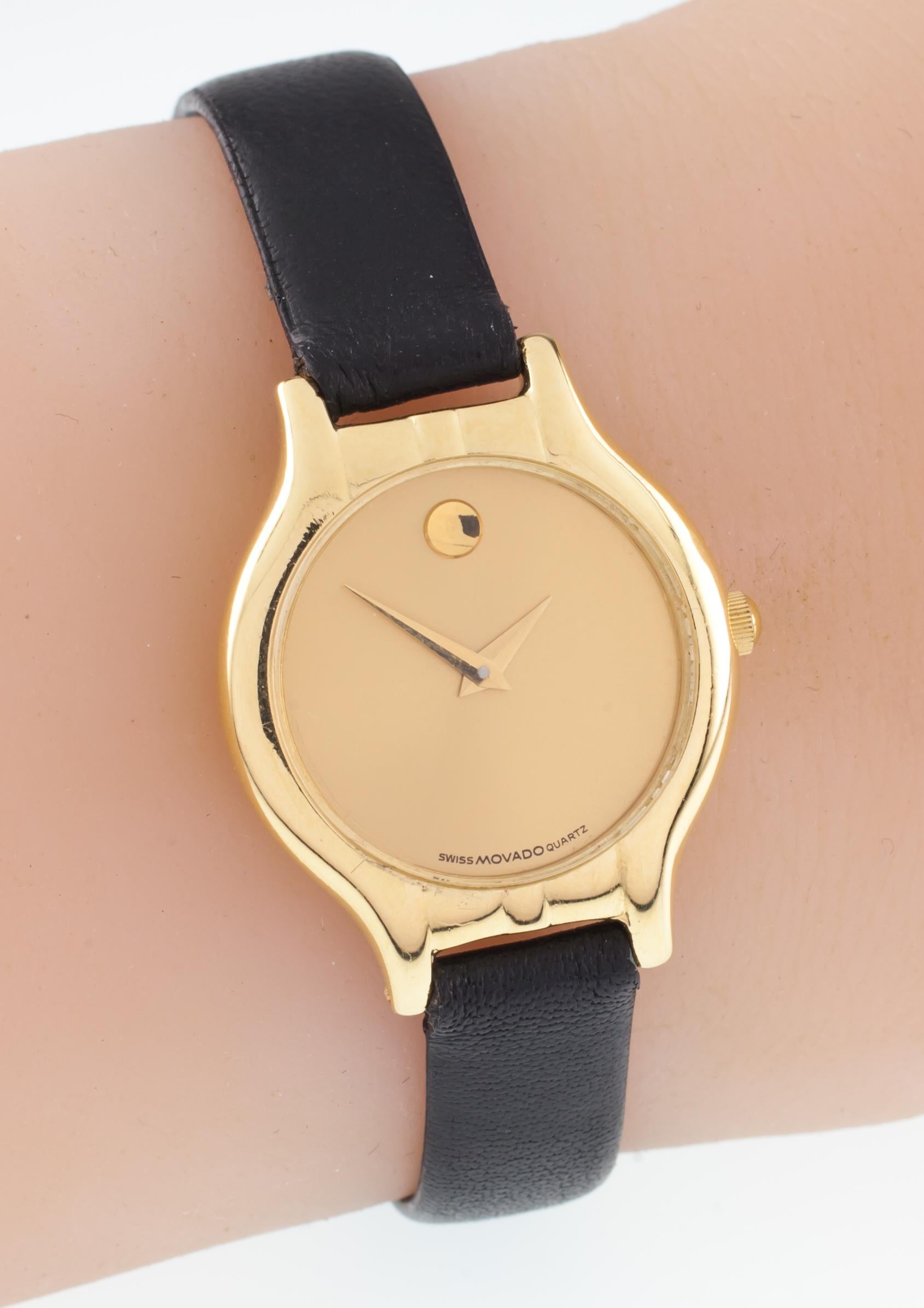 18k Yellow Gold Movado Watch w/ Black Leather Band Nice!
Model #40-25-824
Serial #107347

18k Yellow Gold Case
24 mm in Diameter (25 mm w/ Crown)
Lug-to-Lug Distance = 30 mm
Lug-to-Lug Width = 10 mm
Thickness = 5 mm

Gold Dial w/ Gold Hands (M + H)