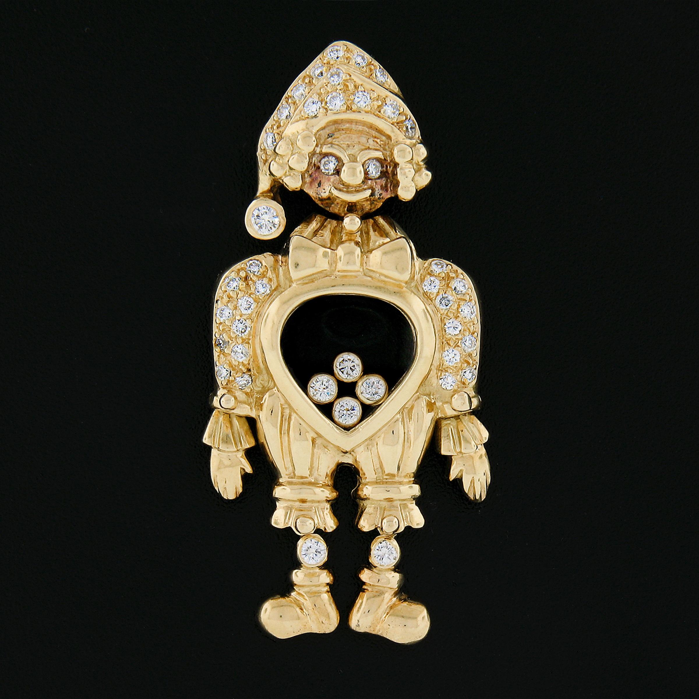 This unique large boy or clown pendant is crafted in solid 18k yellow gold and is adorned with 42 round brilliant cut diamonds totaling approximately 0.65 carats. The pendant features movable legs, head, & 4 bezel set floating diamonds at the center
