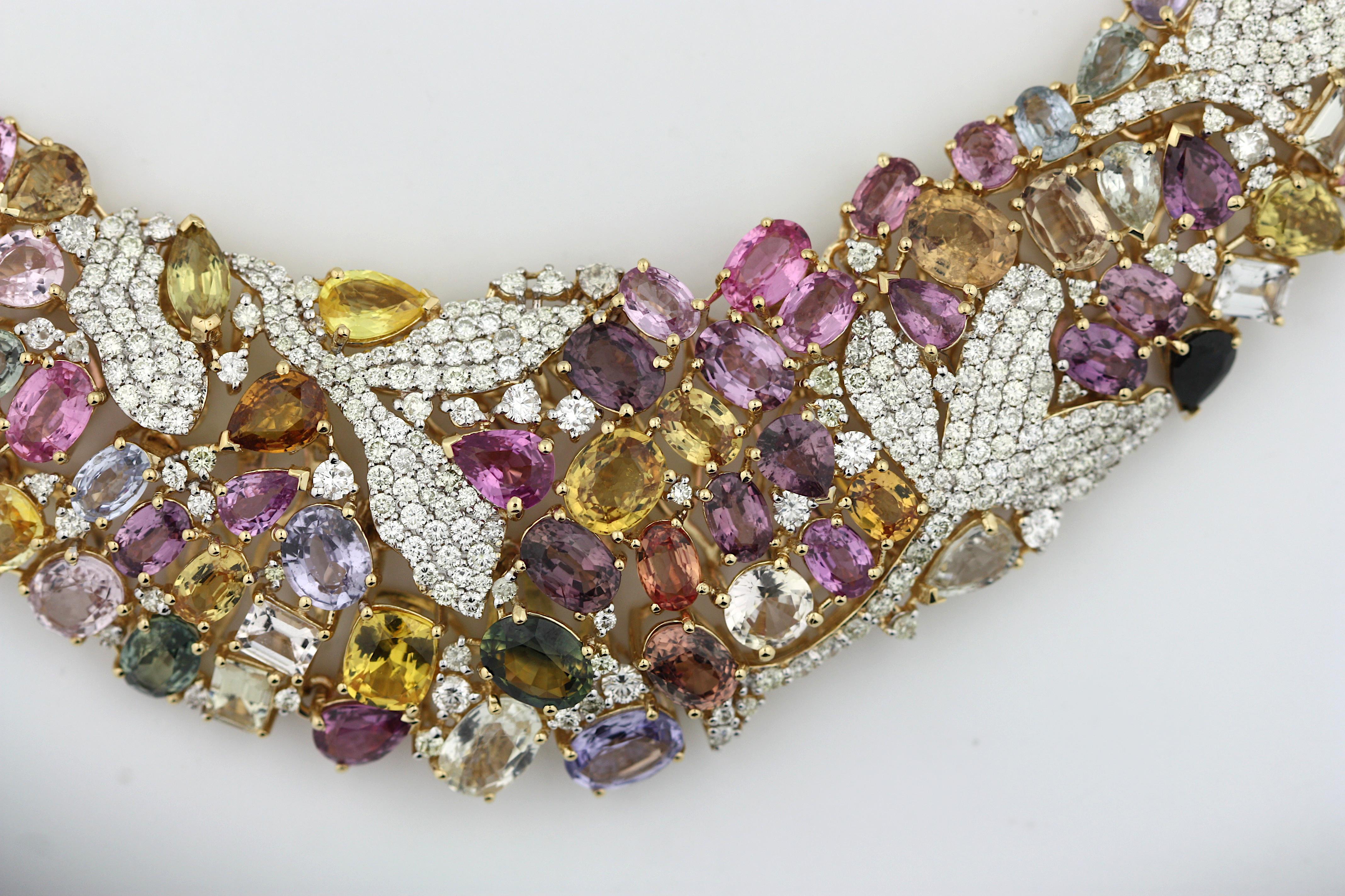 18K Yellow Gold Multi Color Sapphire and Diamond Collar Necklace 
Featuring multi-colored natural, unheated sapphires of emerald, pear, oval and marquise shapes
weighing 124.87 cts., measuring 8.0 x 2.0 mm 
with round brilliant-cut diamonds