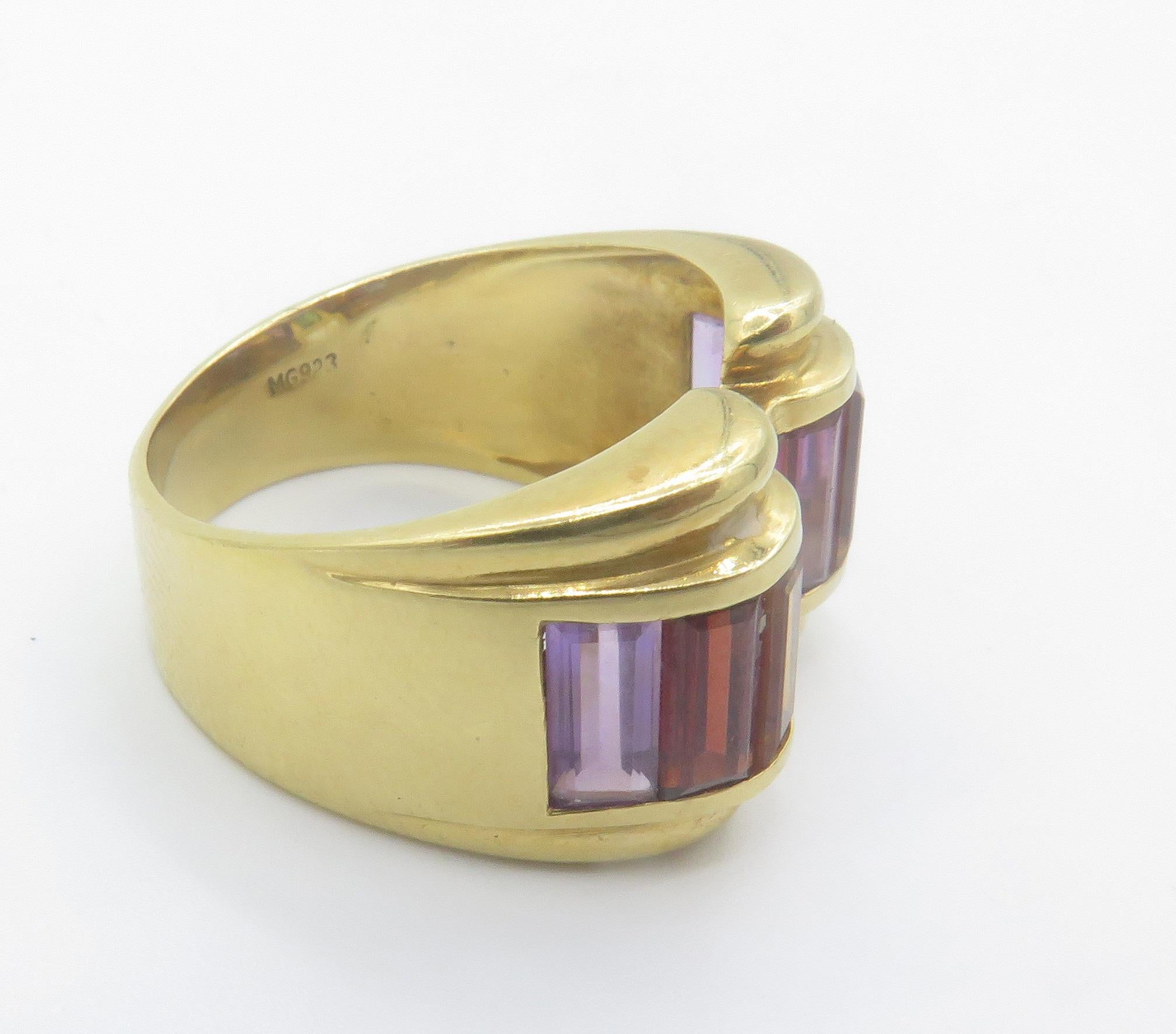 18kt, yellow gold, multi colored stone ring. This, beautifully crafted ring features a matching array of gemstone such as amethyst, citrine, green tourmaline, and garnet all set perfectly the setting and design of this ring is beautifully done in