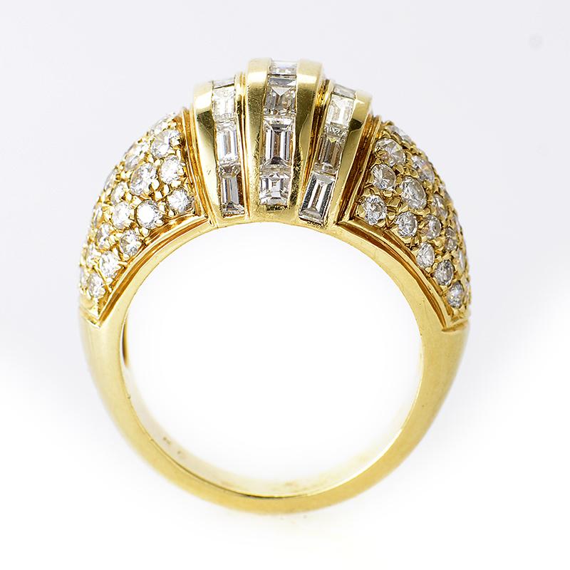 This ring is ravishing and shines with diamonds. This opulent ring is made of 18K yellow gold and is set with ~3.40ct of diamonds.

