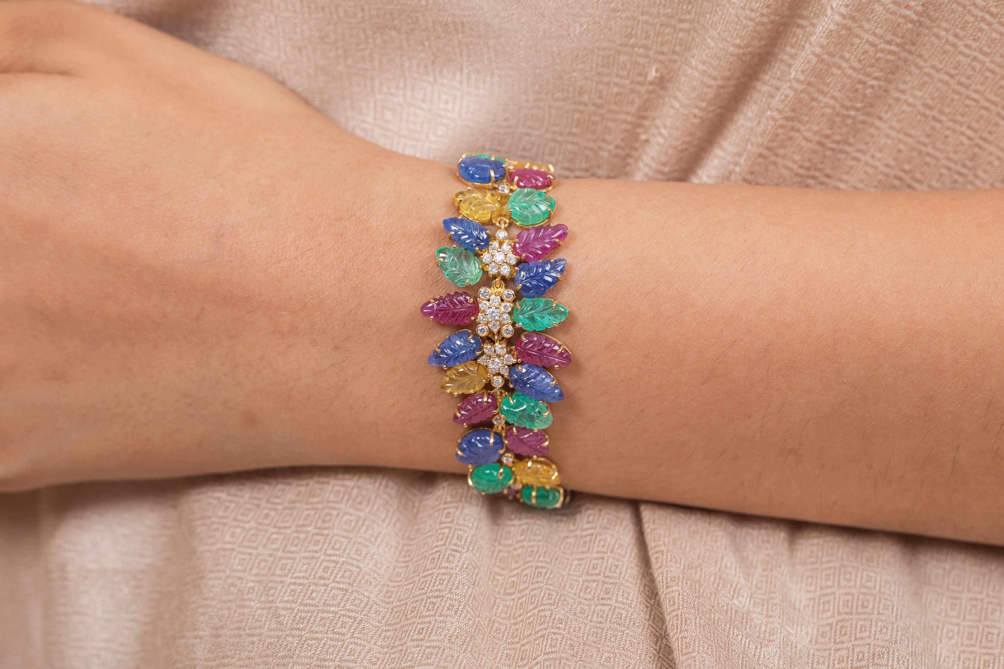 The wearing of charms may have begun as a form of amulet or talisman to ward off evil spirits or bad luck.
This emerald ,ruby ,blue sapphire, yellow sapphire bracelet has a pear cut gemstone and diamonds in 14K Gold. A perfect piece of jewelry to