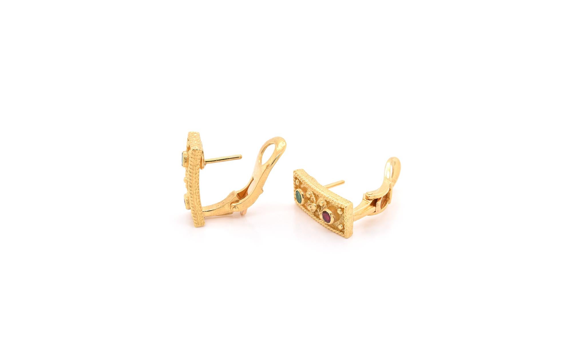 Designer: custom
Material: 18k yellow gold
Gemstones: ruby, emerald = 0.25cttw
Dimensions: earrings measure 7.40mm x 17.62mm
Fastenings: post with omega back
Weight: 9.11 grams

