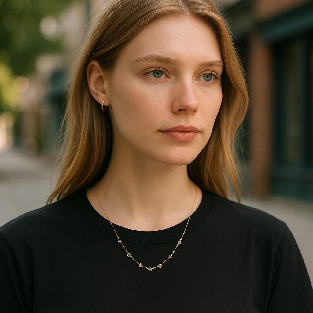 Elevate your jewelry collection with this exquisite Hueb 18K Yellow Gold Multi-Gemstone Station Necklace, a radiant celebration of color and fine craftsmanship. Designed by the acclaimed Brazilian luxury house Hueb, this elegant piece reflects the