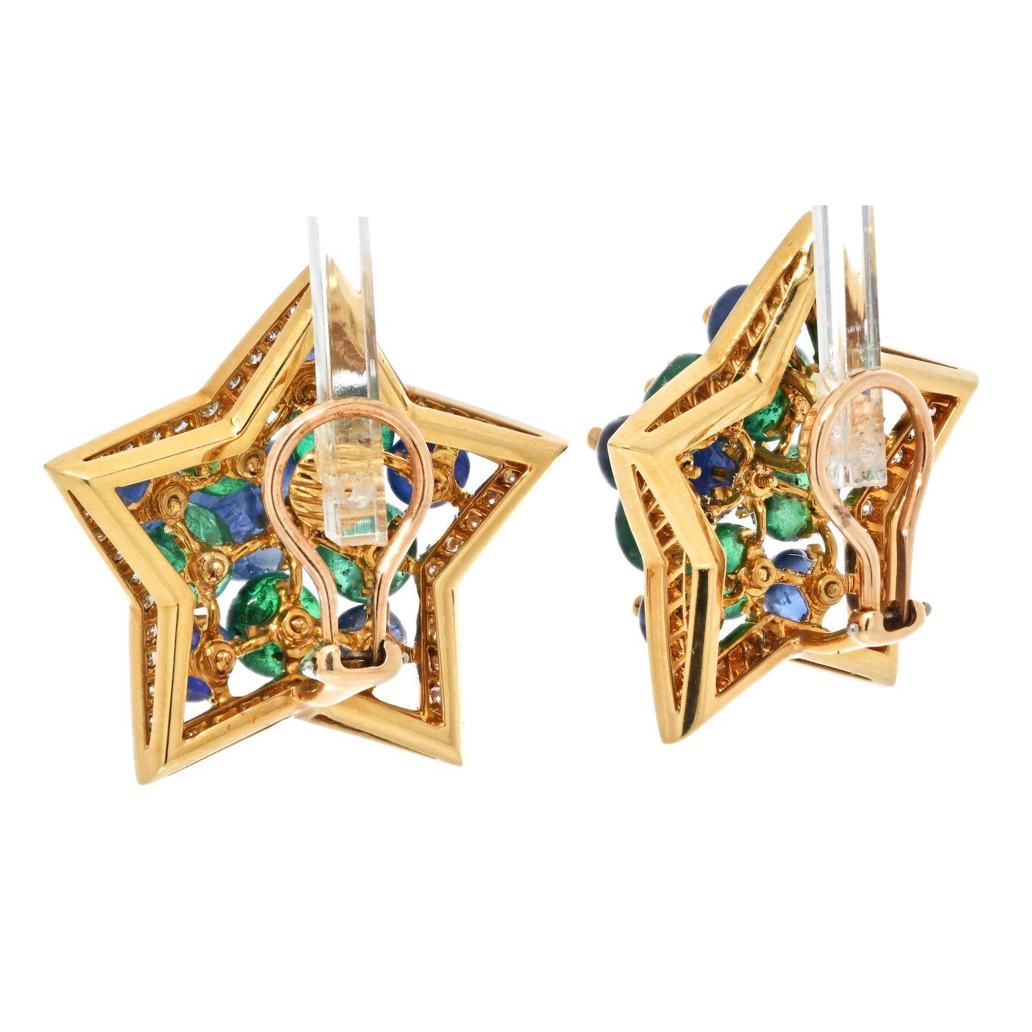 Estate 18k yellow gold clip earrings mounted with sapphires, emeralds and diamonds. These are lovely earrings made with translucent green emeralds and medium deep hue sapphires. Round cut diamonds paved on a frame of each star making these beautie