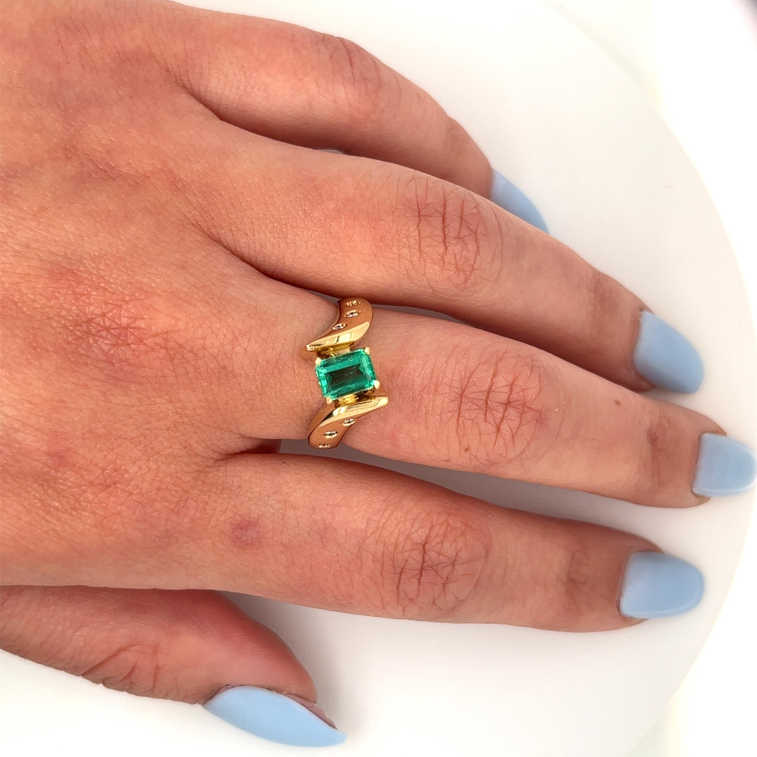 Women's 18k Yellow Gold Natural Emerald and Floating Diamond Bypass Statement Ring For Sale