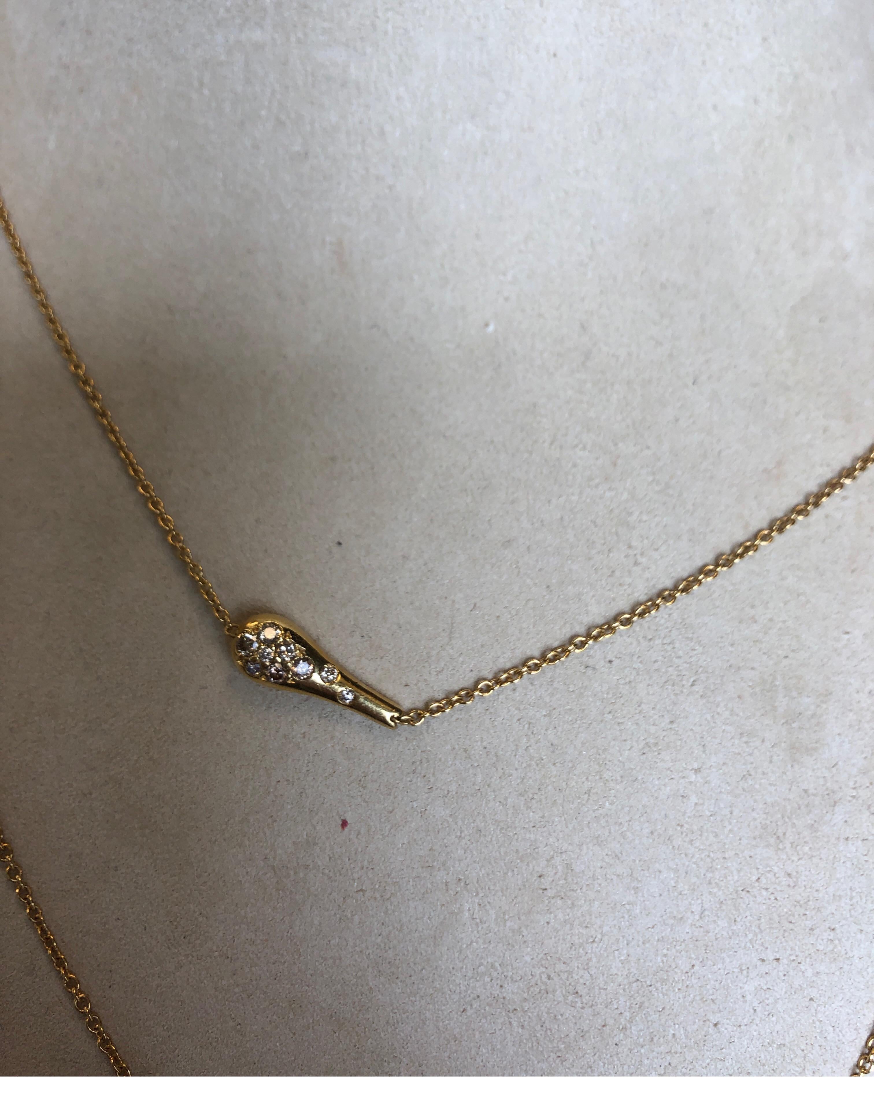 18K yellow gold neck chain with eight double sided tear drop shape elements with round cognac diamonds weighing 1.40cts total
Last retail $6500