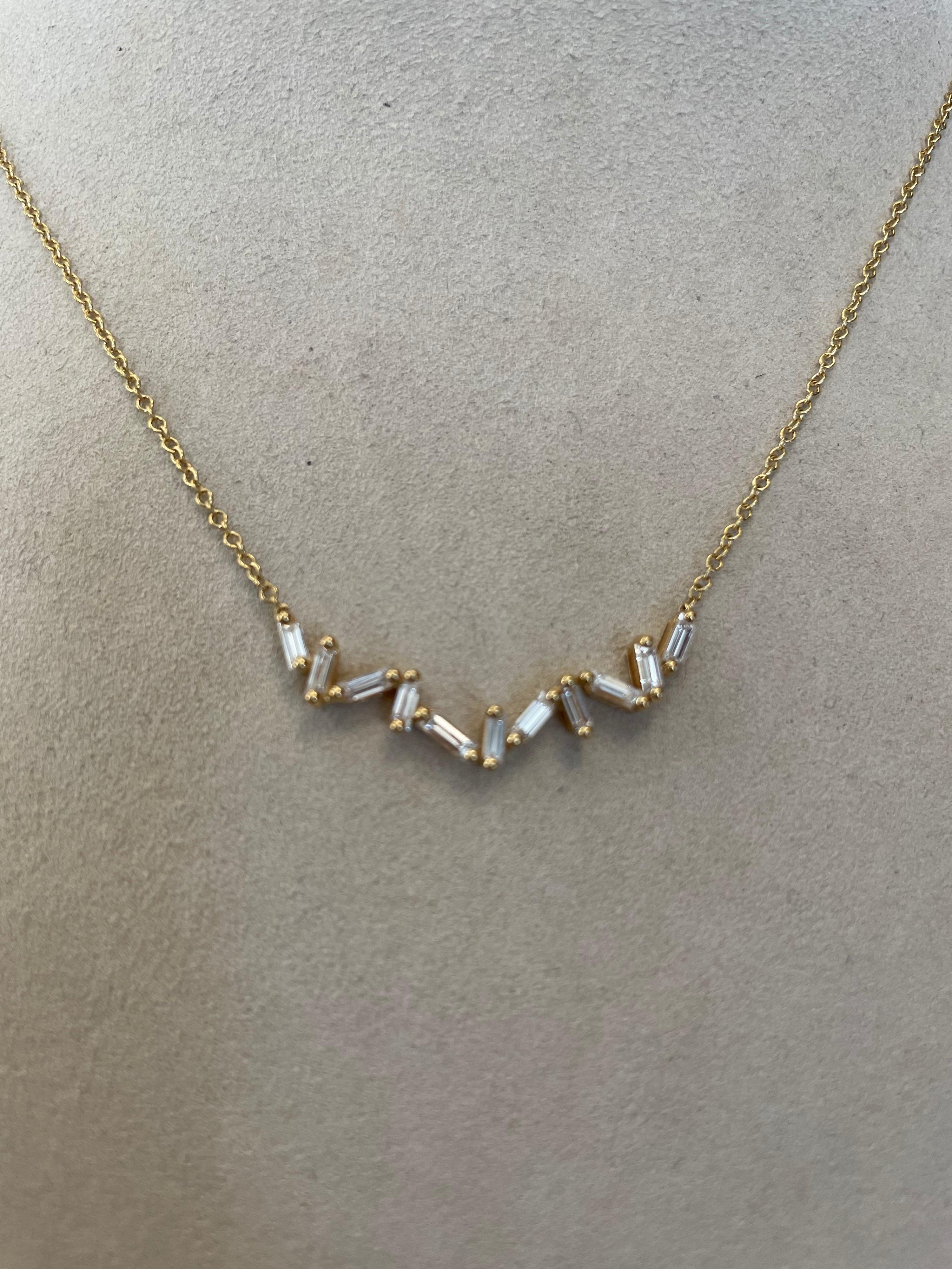 18K Yellow gold necklace prong set with 11 straight baguette diamonds weighing .64cts total, in an abstract orientation, 16.5 inches long.
last retail $2000