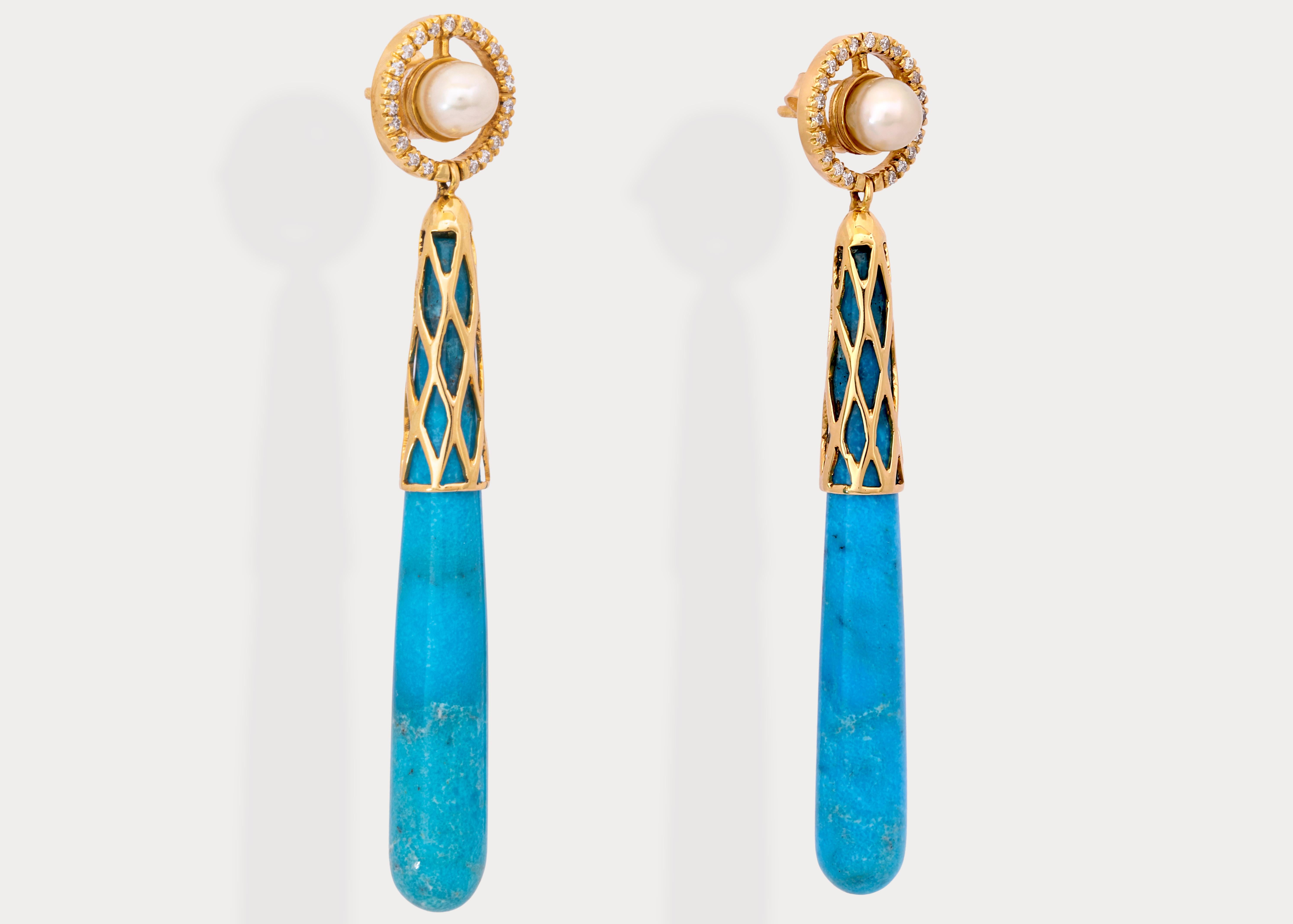 One of a kind ombre pair of Nishapuri turquoise cones hand cut and polished in Germany are partially covered in patterned 18k yellow gold.
The studs are Bahraini natural pearl buttons surrounded by a diamond halo.

Gold Weight: 7.6 g
Pearl Weight: