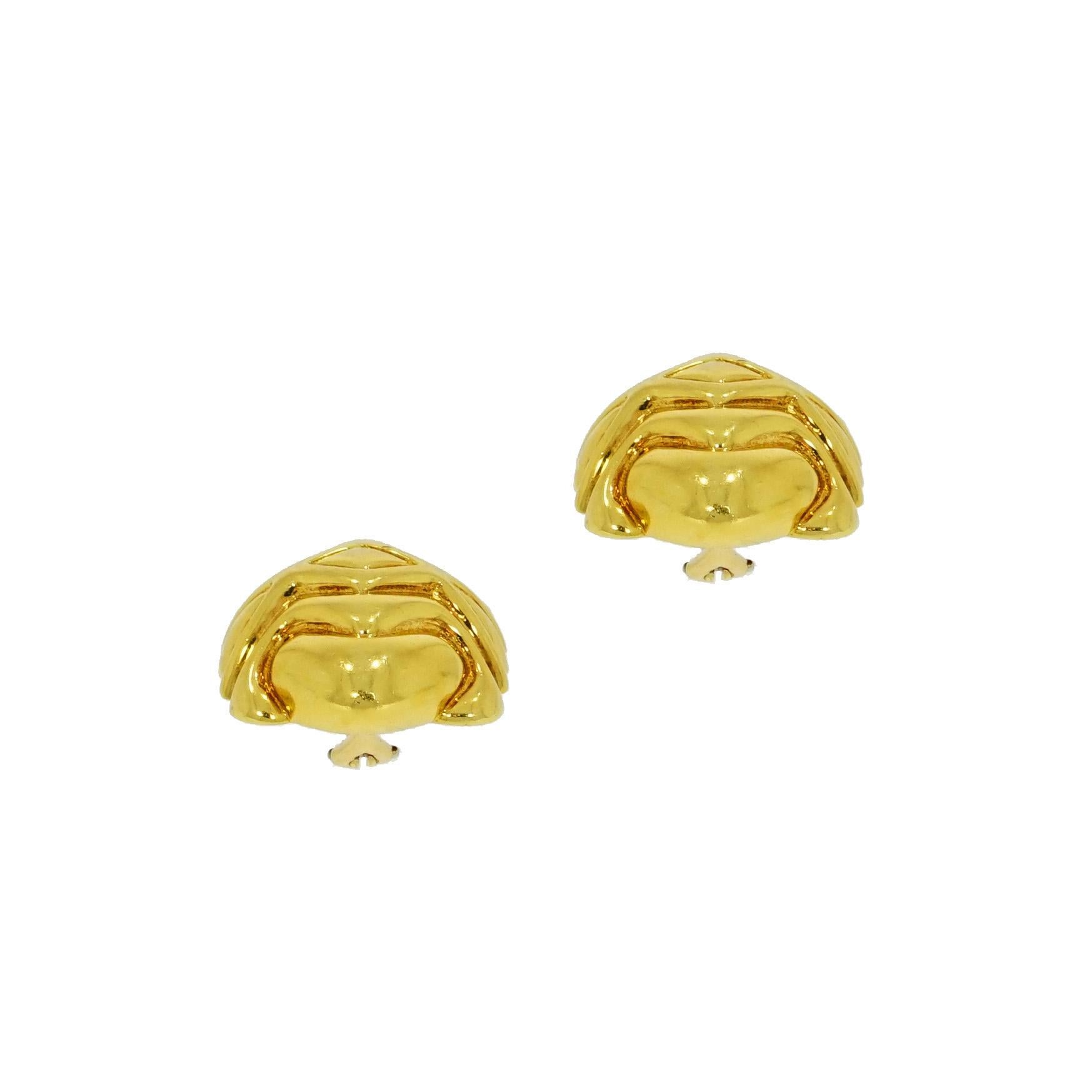 Estate Non pierced clip-on earrings circa 1970-80's. The design is decorated with a pattern and crafted in 18-karat yellow gold with high polished finishes, omega clip backs. Very pristine condition consistent with age and wear. They are elegant and
