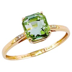 Anillo de oro amarillo de 18 quilates de turmalina verde octogonal con diamantes