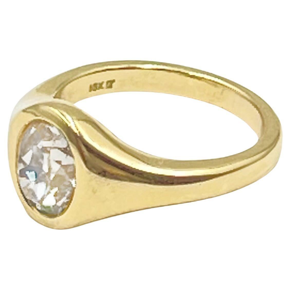 Gypsy-style ring centering a brownish-yellow old mine cut diamond weighing 1.95 carats set in polished 18k yellow gold. Ring measuring 10.46mm at top tapering to 2.5mm at the base of the shank. Size 6.5 (resizable).