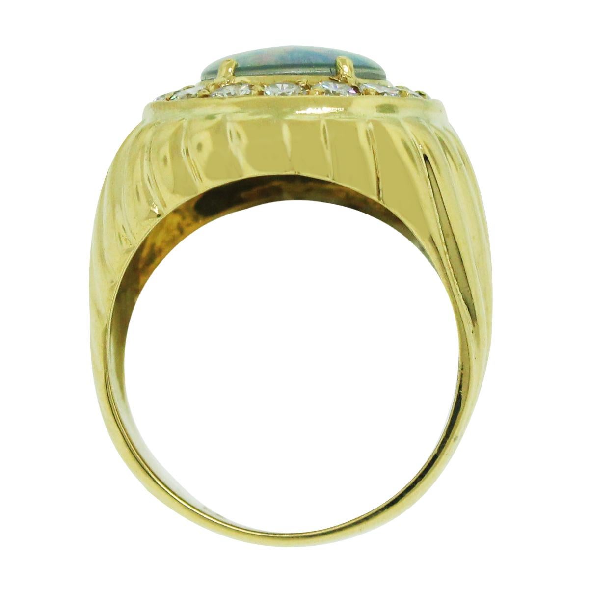 Material: 18k Yellow Gold
Gemstone Details: Oval opal gemstone measuring 14.5mm x 10.6mm
Accent Diamond Details: Approximately 1.12ctw round brilliant accent diamonds. Diamonds are H/I in color and SI1 in clarity.
Ring Size: 8.25 (can be