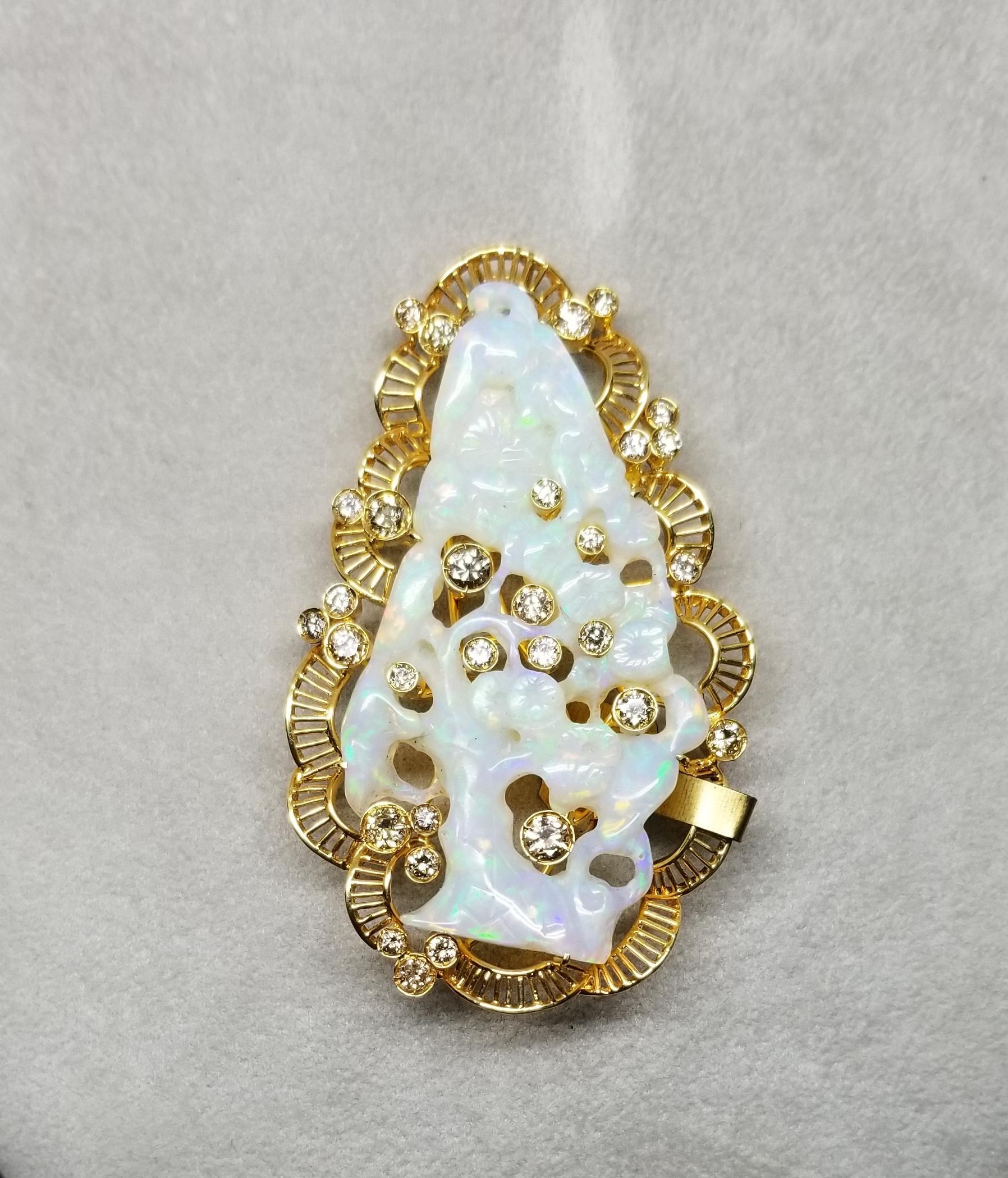 This piece of fine jewelry was designed and hand crafted by “Moshi” of New York, it was found in a vault from an estate sale and was never used.  18k yellow gold opal and diamond pin/pendant, with 1 hand carved opal and 29 diamonds of very fine