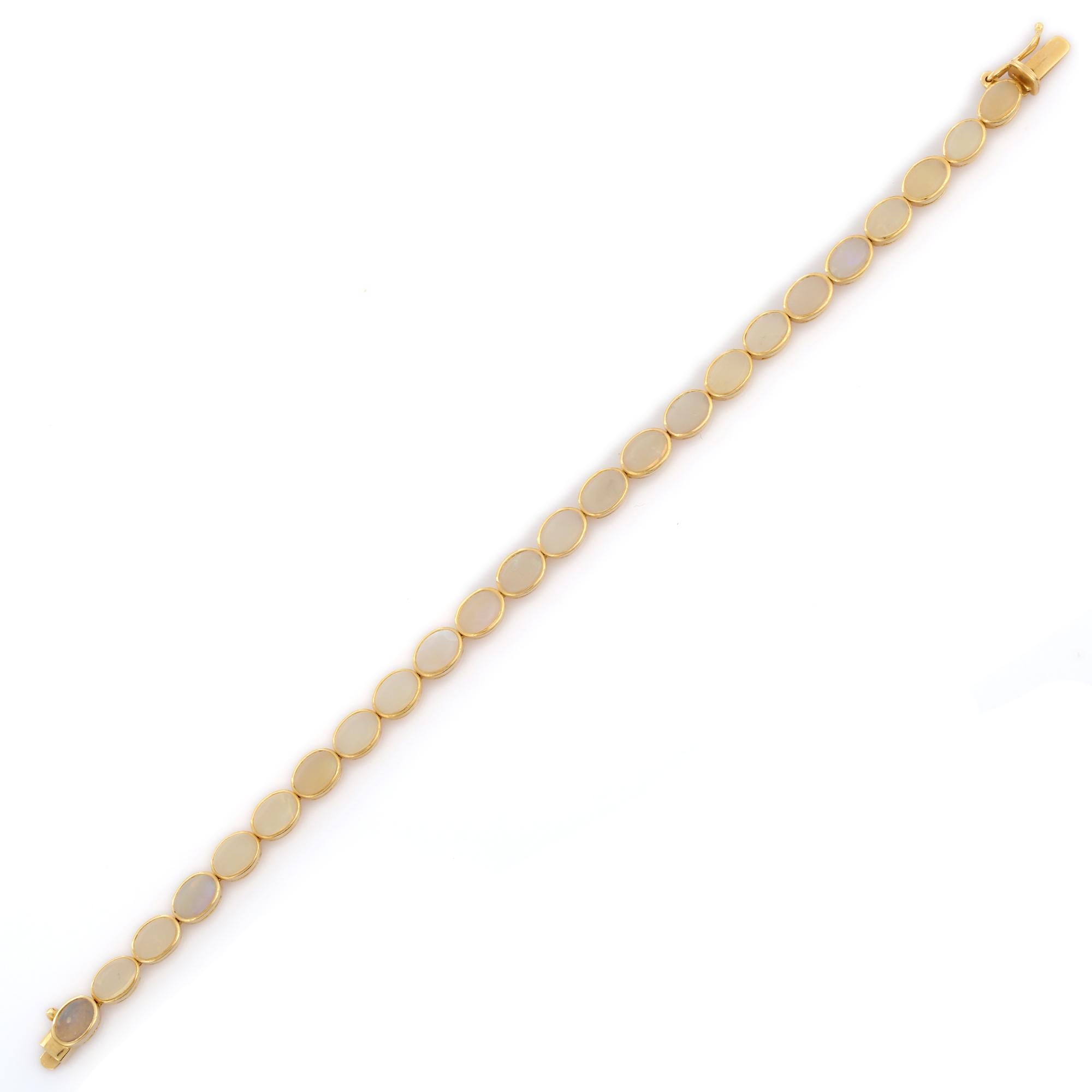 This Handcrafted Bezel Set Oval Moonstone Tennis Bracelet in 18K gold showcases 7.45 carats endlessly sparkling natural rainbow moonstone. It measures 7 inches long in length. 
Rainbow moonstone can help you attract the right people into your life