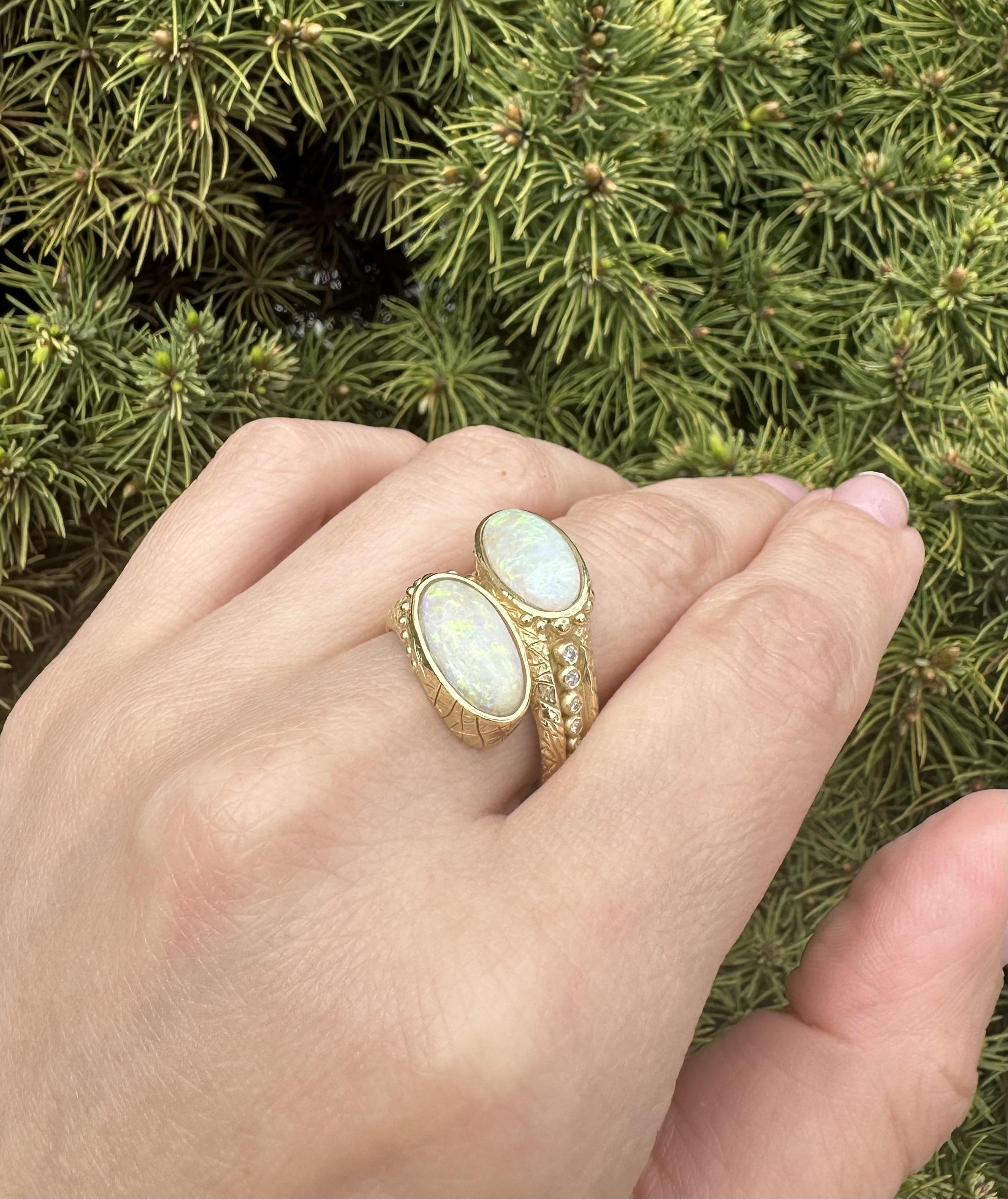 --Stone(s):--
(2) Natural Genuine Opal - Matching Custom Cut - Bezel Set - White Color Back w/ Very Nice Play of Green, Yellow & Orange Colors - 14.3x7.5mm each (approx.)
(16) Natural Genuine Diamonds - Round Brilliant Cut - Graduated Bezel Set -