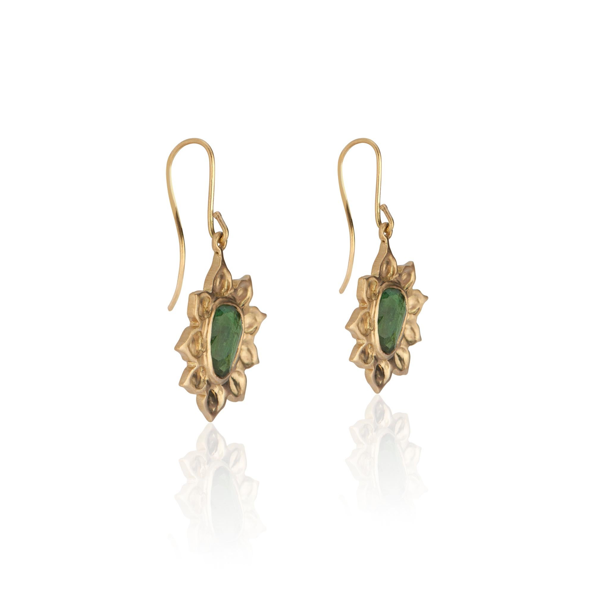 18k yellow gold pendant earrings
Organic-shape rose cut moss-green tourmalines
Tourmaline weight approximately 2.29 carats total carat weight
Approximately 1.75 inches (3.75 centimeters) long
18k yellow gold ear wires
Matte finish
Exclusive