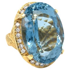 18k Yellow Gold Oval 72.19 ct Aquamarine Ring with Appx 1 ct Diamond Size 7.75
