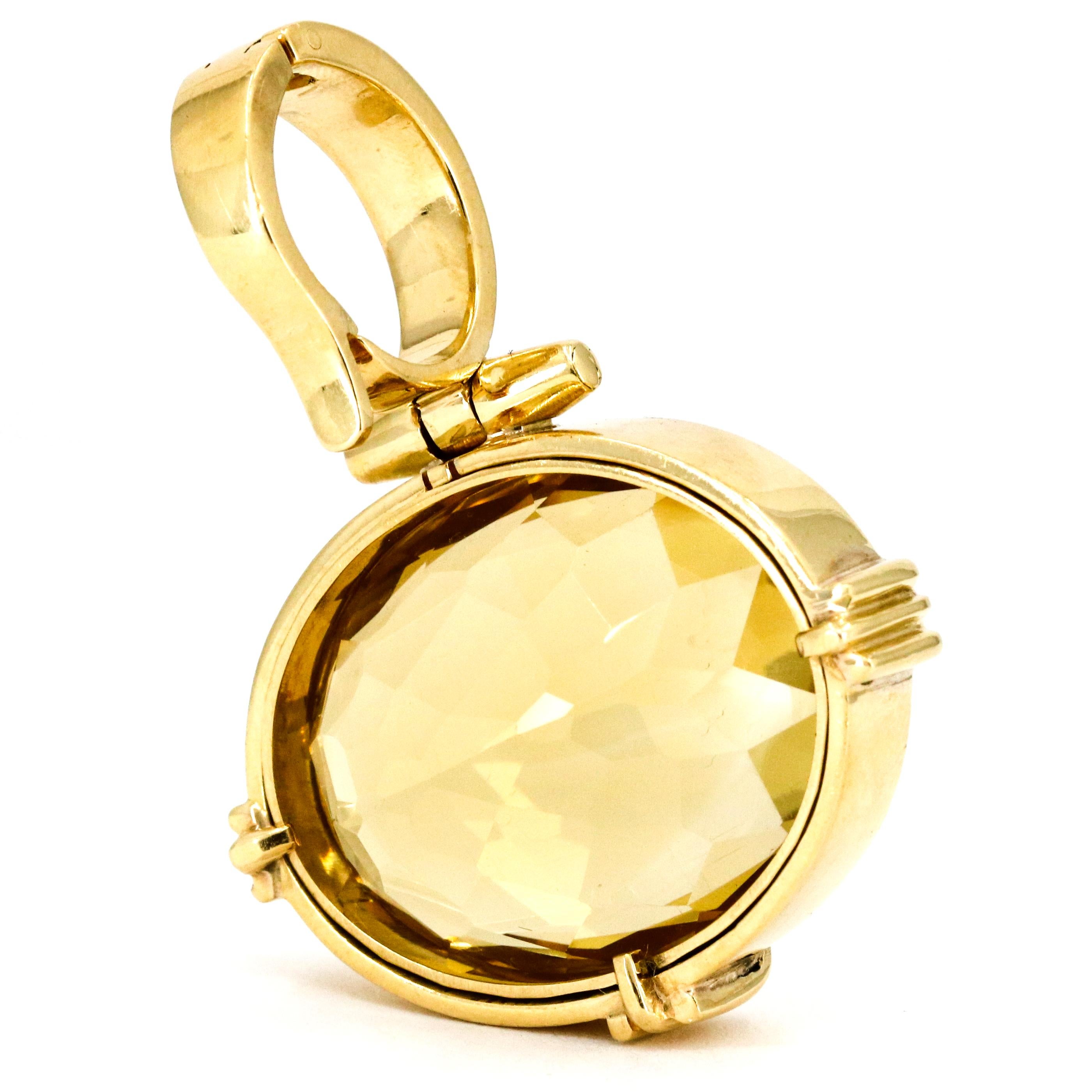 Oval cut Citrine pendant in 18-karat yellow gold with large enhancer bale. 

Height, 45mm
Width, 31mm
Depth, 13.5mm
Weight, 26.6 grams 