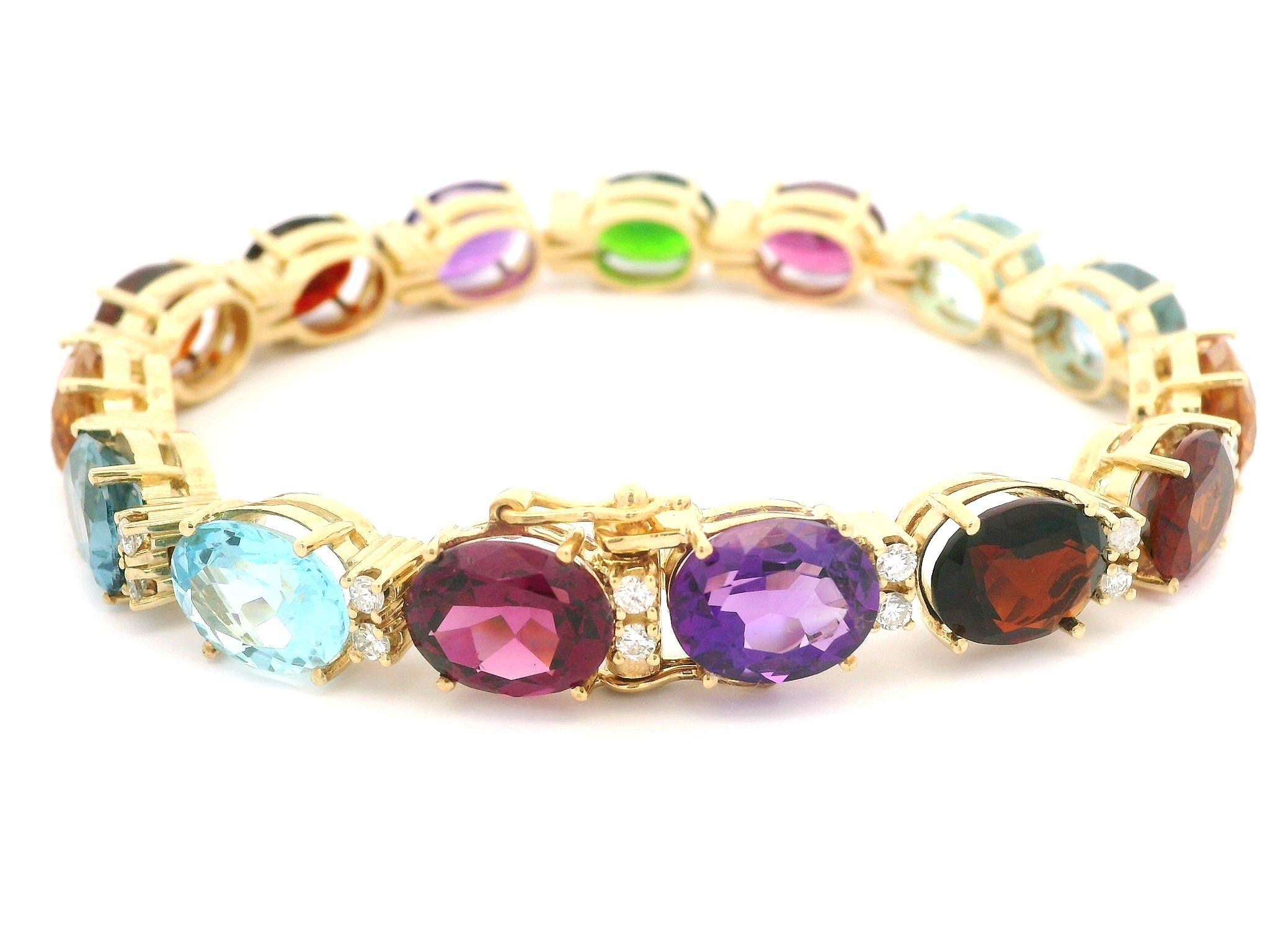 –Stone(s)–
(30) Natural Genuine Diamonds - Round Brilliant Cut - Prong Set - G/H Color - VS1-SI1 Clarity - 0.90ctw (approx.) 
(15) Genuine Colored Stones - Oval Brilliant Cut - Prong Set - Pinkish Red/ Light Blue/ Yellow/ Orange/ Red/ Purple/ Green/