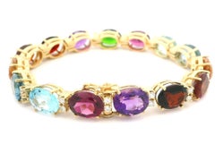 Pulsera de eslabones de oro amarillo de 18 quilates con diamantes ovalados y piedras de color auténticas vívidas
