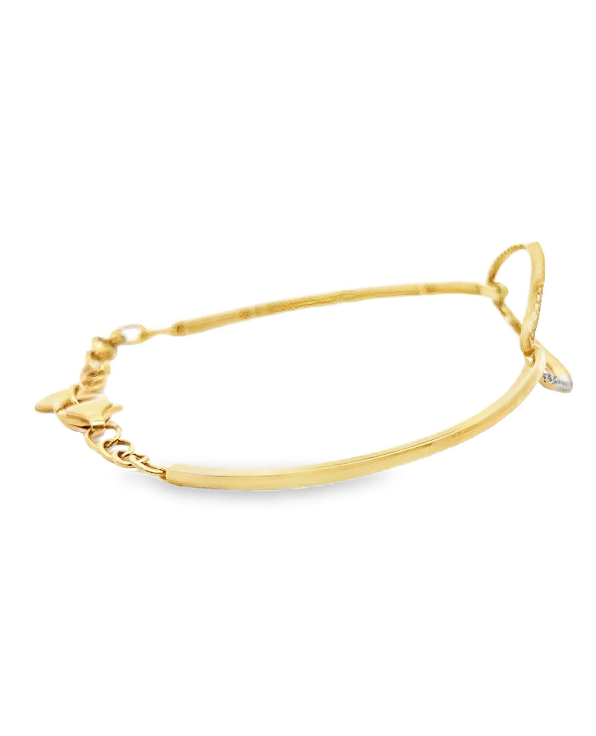 Bracelet ovale en or jaune 18 carats garni de diamants ronds à facettes pesant 0,39 carats au total.  Le bracelet est réglable.

- Les diamants sont de couleur G et de pureté VS2/SI1.
- Fermeture en forme de homard.