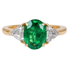 Bague cocktail en or jaune 18K avec émeraude ovale et diamant brillant