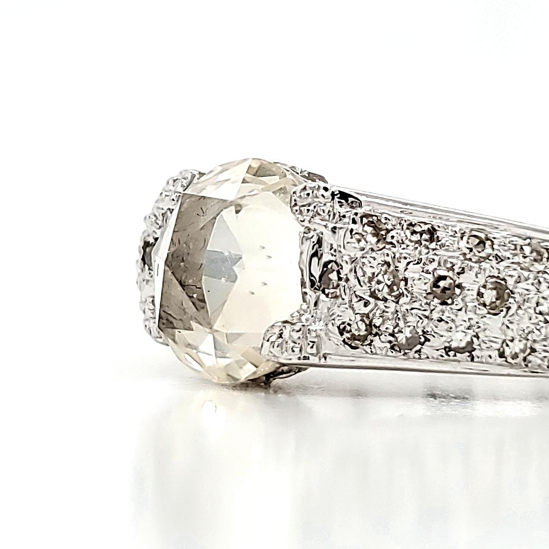 Illuminate your love story with the vibrant glow of our radiant sunbeam engagement ring, where the warmth of a 1.63-carat yellow sapphire meets the brilliance of 0.69 carats of round diamonds.

All set in gleaming 18k white gold, weighing 4.79