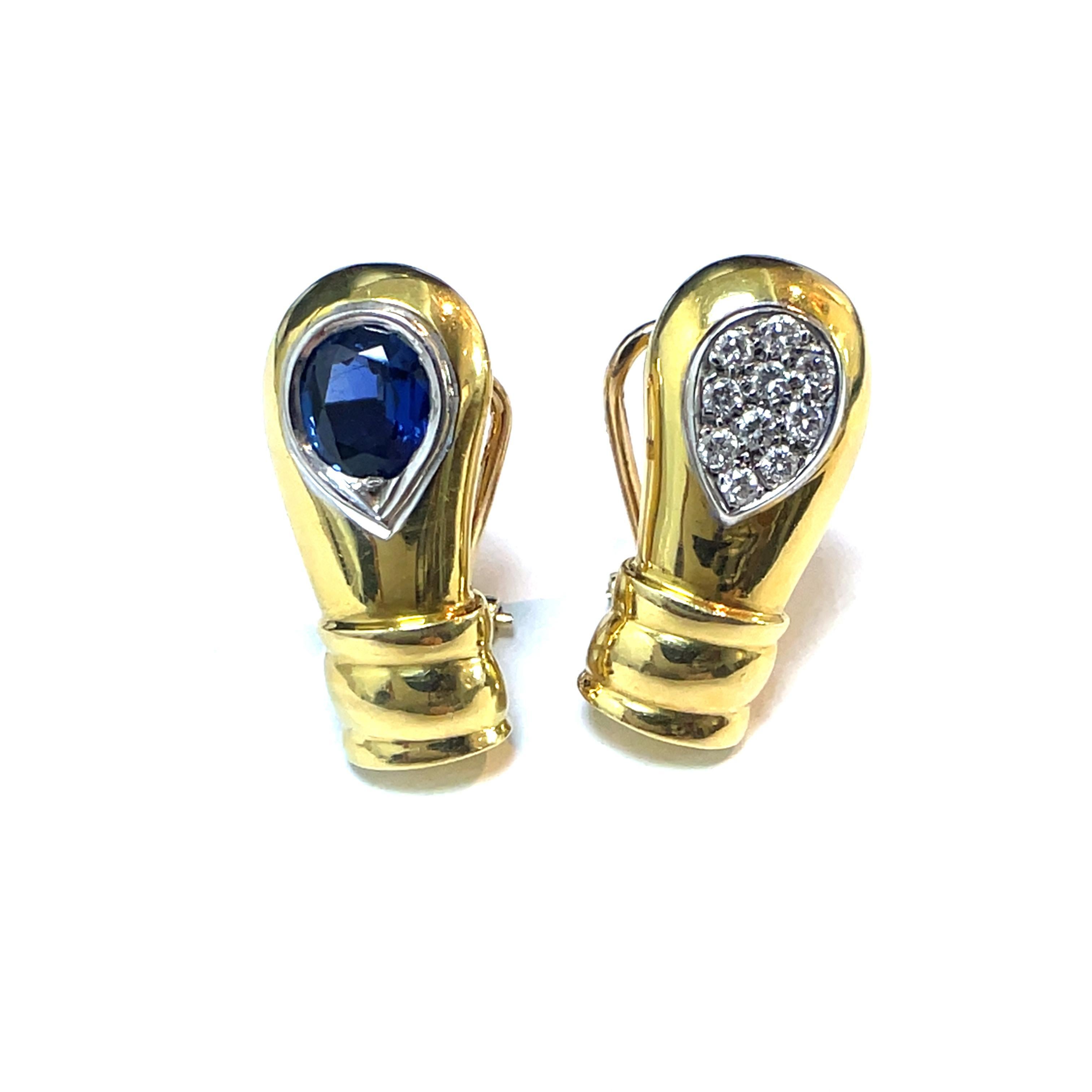 Élevez votre élégance avec cette superbe paire de boucles d'oreilles en or ornées de diamants et de saphirs, méticuleusement réalisées en luxueux or jaune 18 carats. Chaque boucle d'oreille présente une combinaison captivante de diamants ronds de