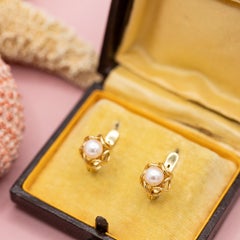 18K yellow gold pair of abstract, organic-shaped gold earrings with central pear