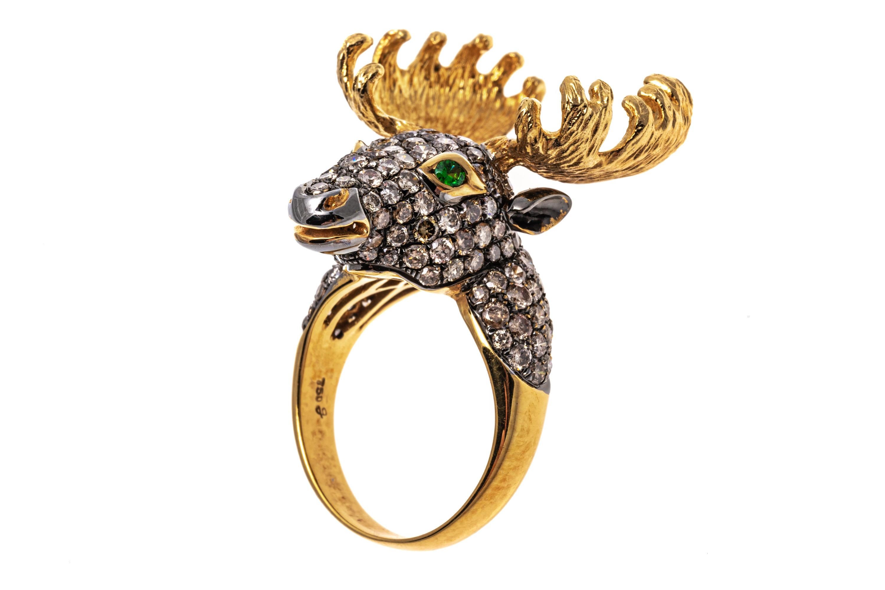18k yellow gold ring. This charming ring is a handsome figural moose head,  decorated with large, brushed finish antlers and trimmed in the entirety with pave set, round faceted, cognac color diamonds, approximately 2.08 TCW.  Round faceted, bright