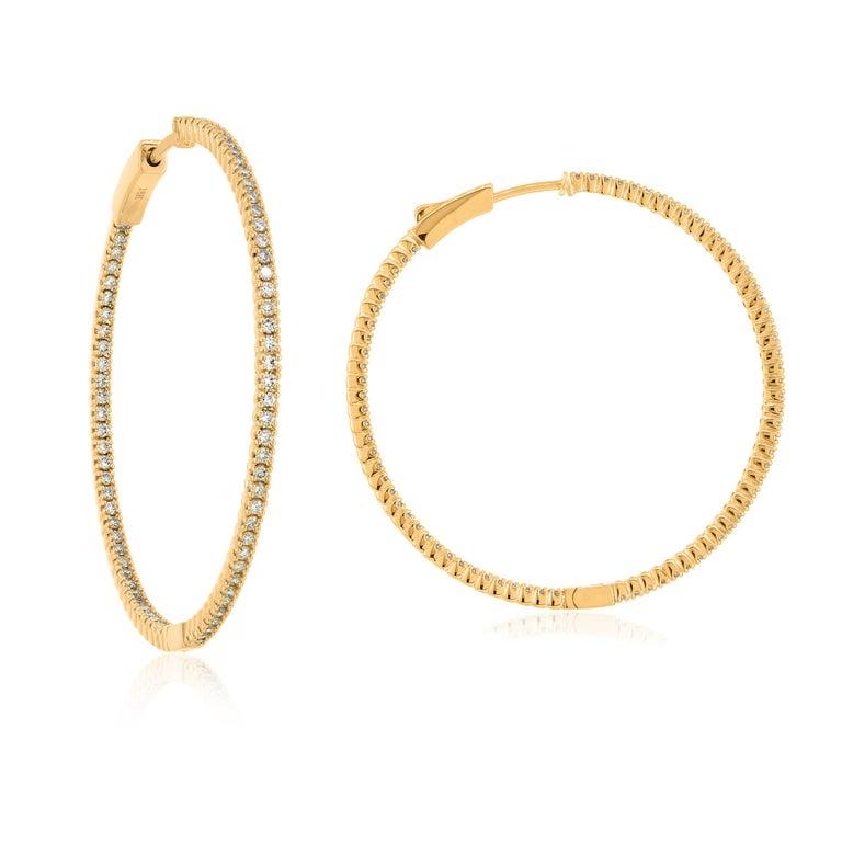 Elegant, timeless, captivating, round brilliant diamond huggie hoop earrings in 18k yellow gold , for pierced ears. These elegant earrings feature 68 round brilliant cut diamonds with GH color and I1 clarity are pave set both on the inner and outer