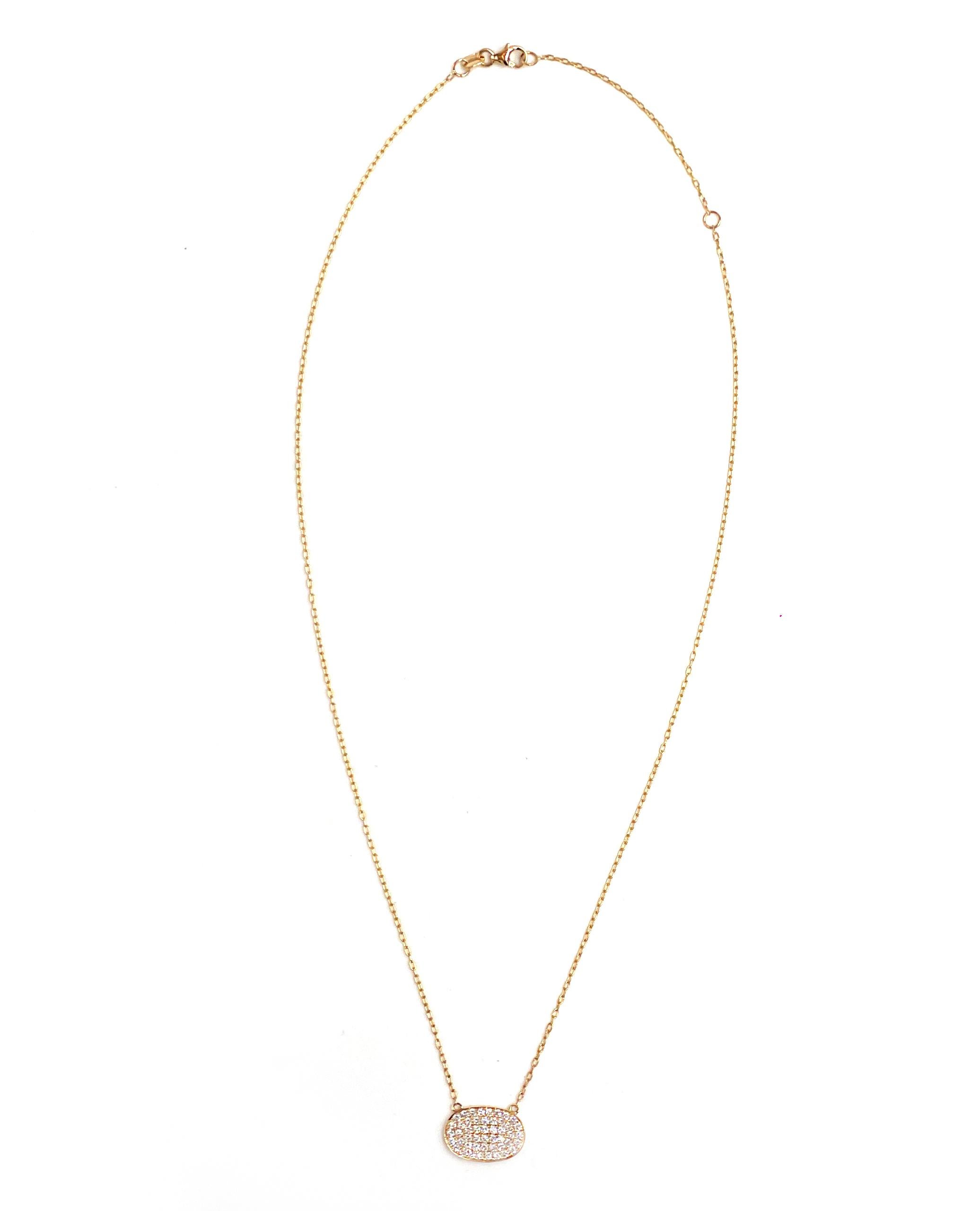 18K yellow gold East-West oval shape necklace with 0.66 carat pave set round, brilliant-cut diamonds.

* Diamonds are G/H color, VS2/SI1 clarity.
* Can be worn 18 inches or 16 inches long.